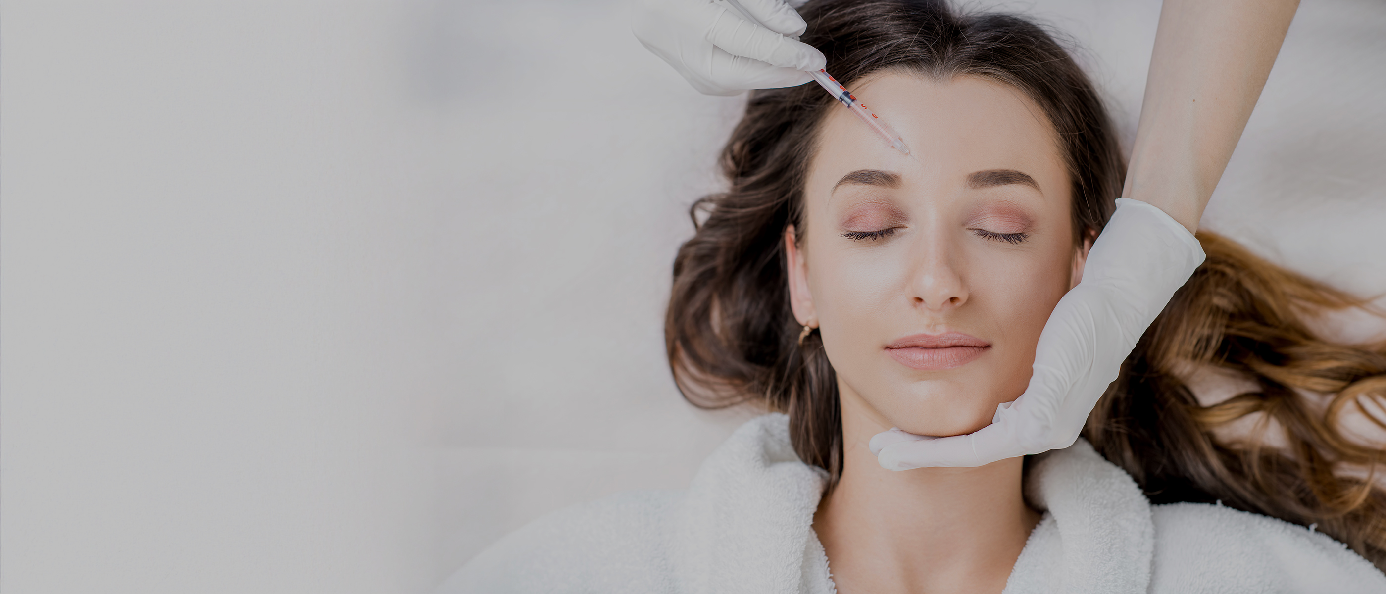  Woman receiving injectable treatment