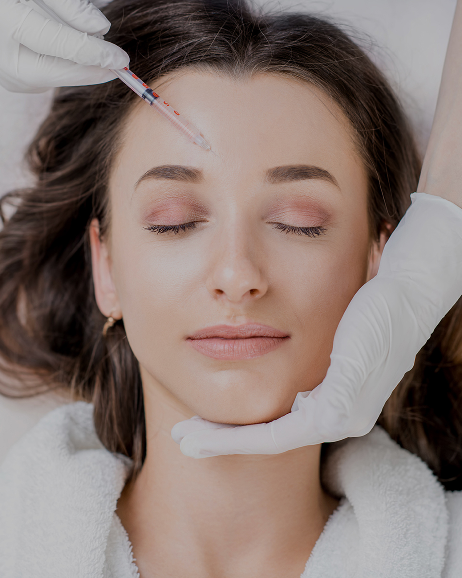 Woman receiving injectable treatment