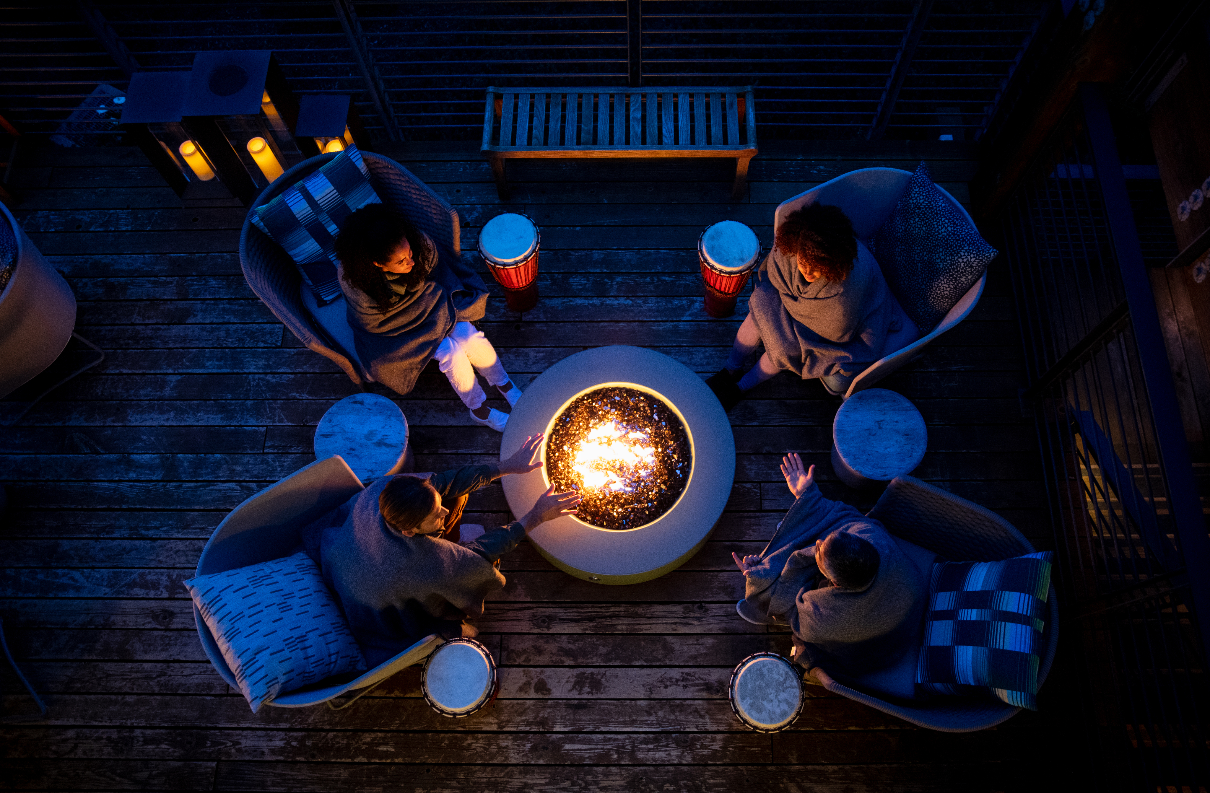 People Outside at Woodside Around the Fire in the Evening