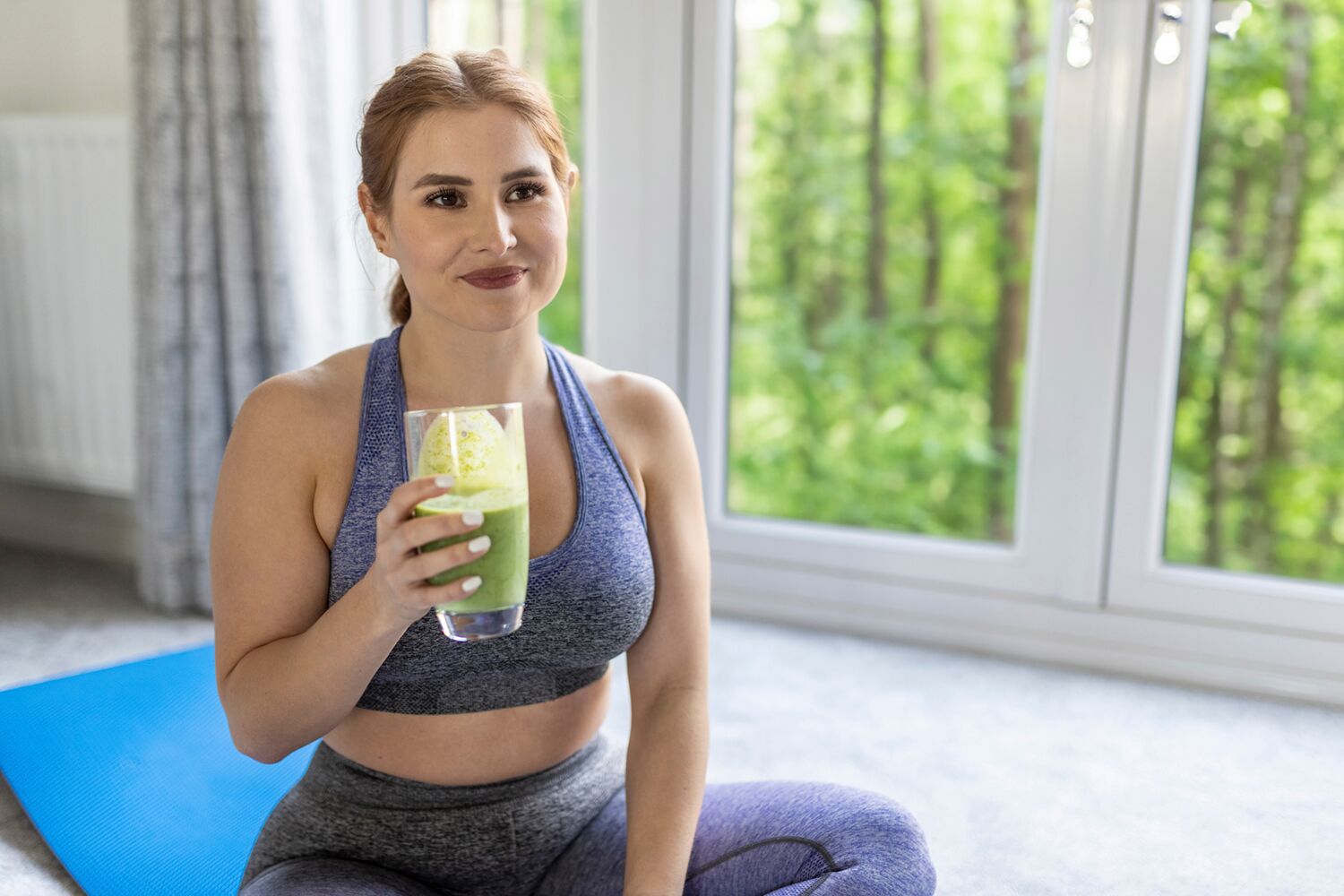 Woman Drinking a Green Smoothie