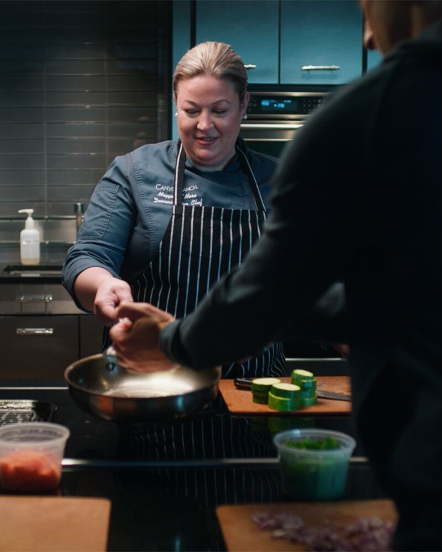 Woman Cooking at Demo Kitchen Lenox  