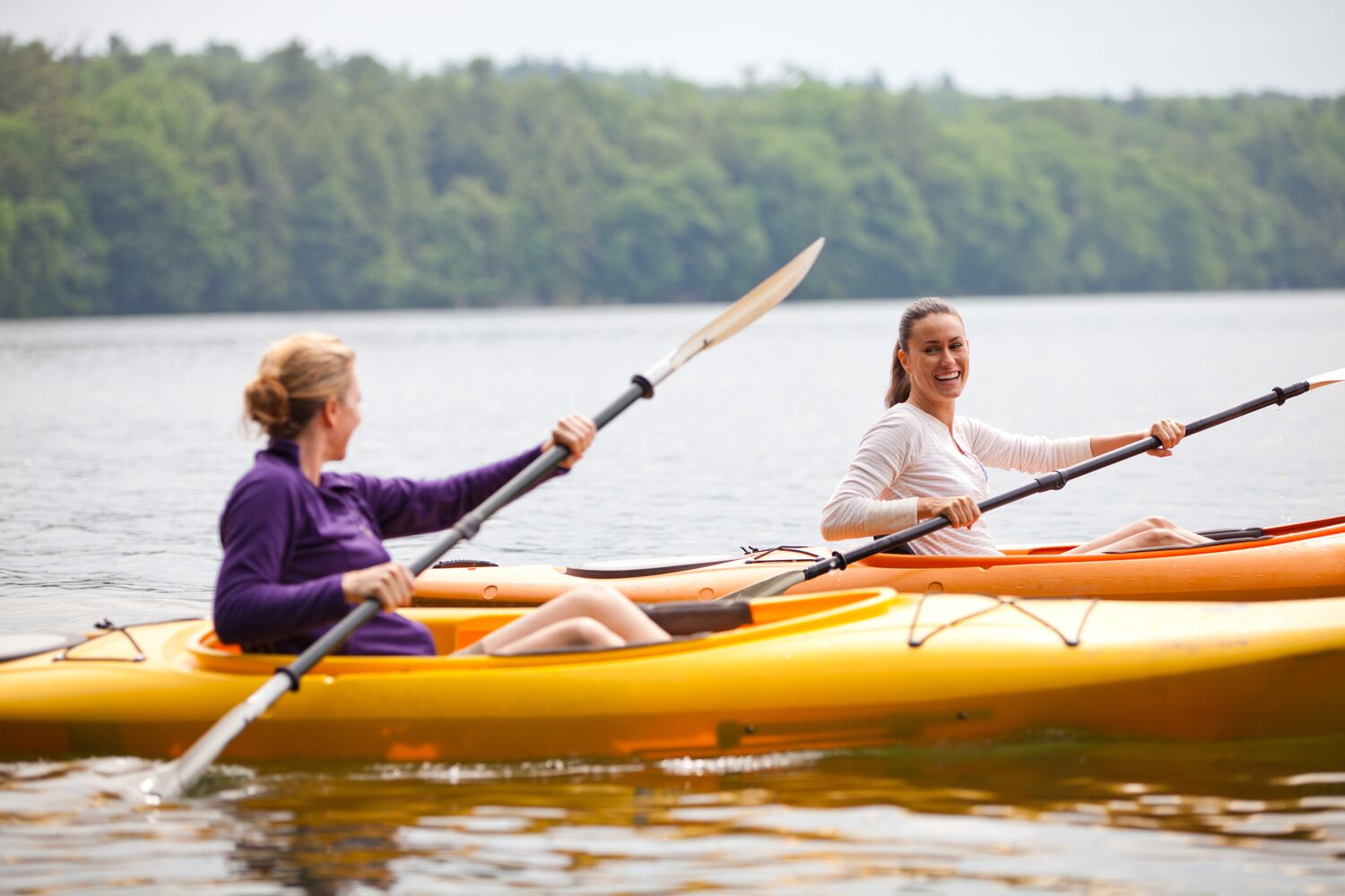 Close-up image of a couple kayaking at Canyon Ranch Lenox Health Spa Resort