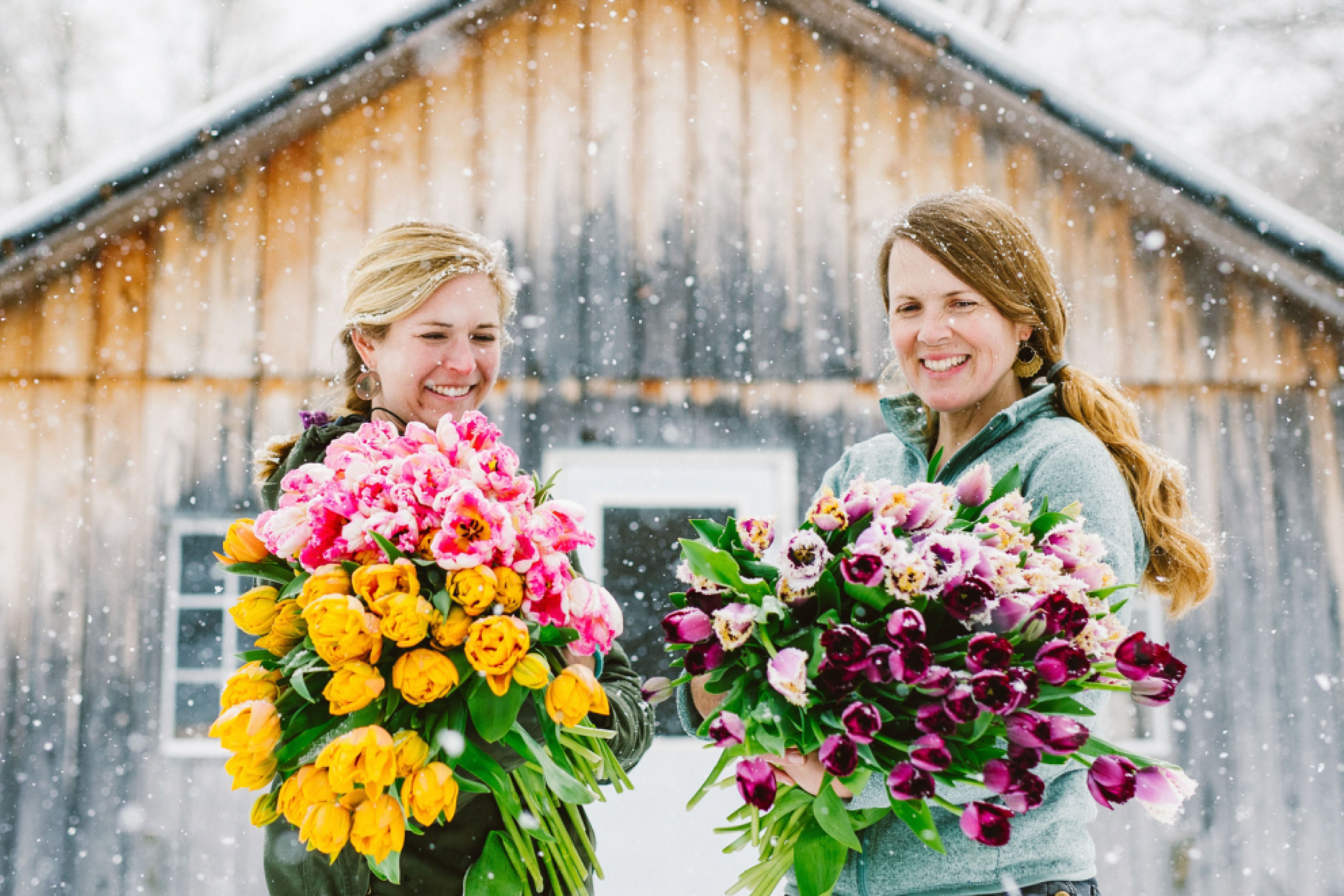 two women holding flowers