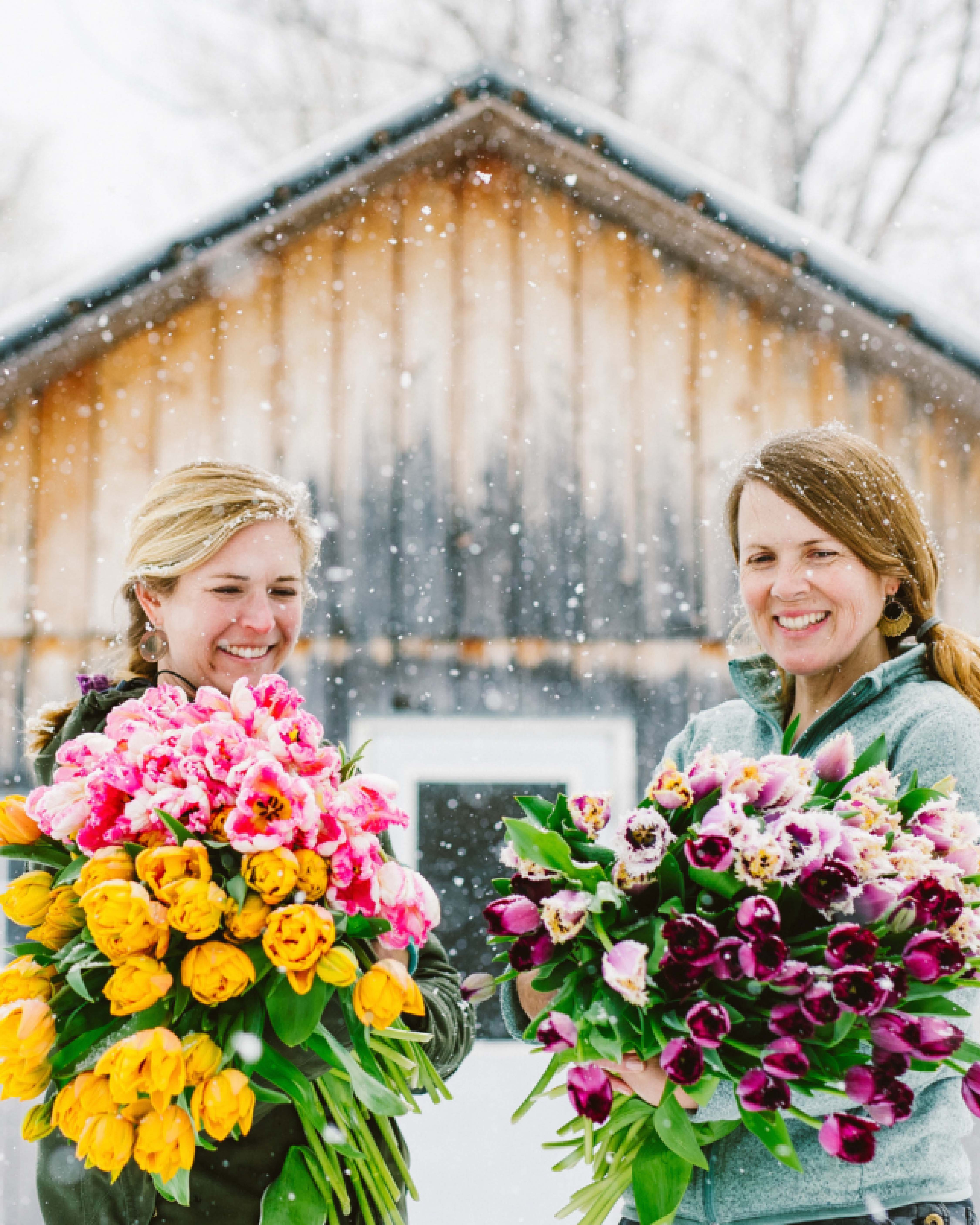 two women holding flowers