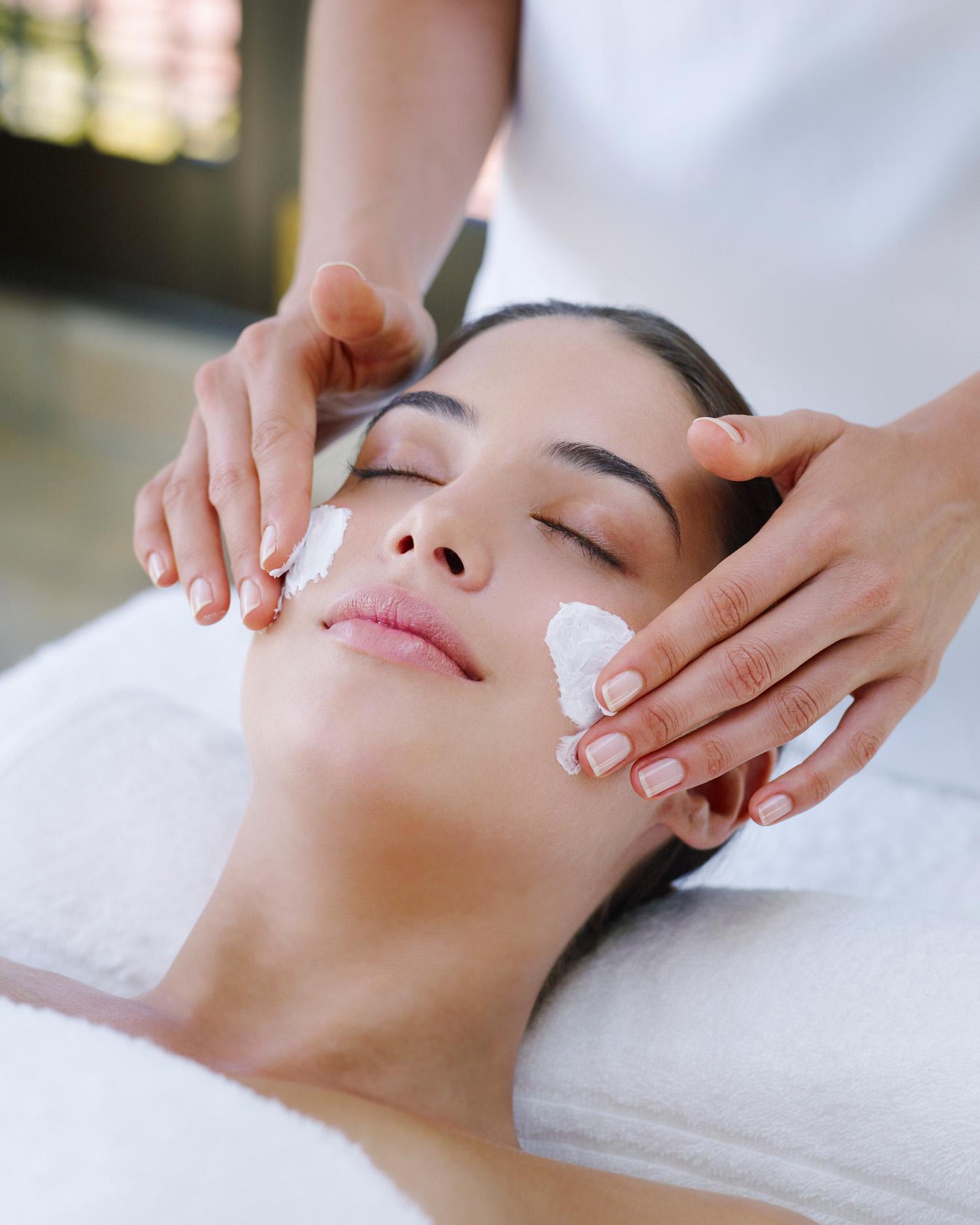 Woman getting a facial in the spa at Canyon Ranch Tucson Fitness + Spa Resort