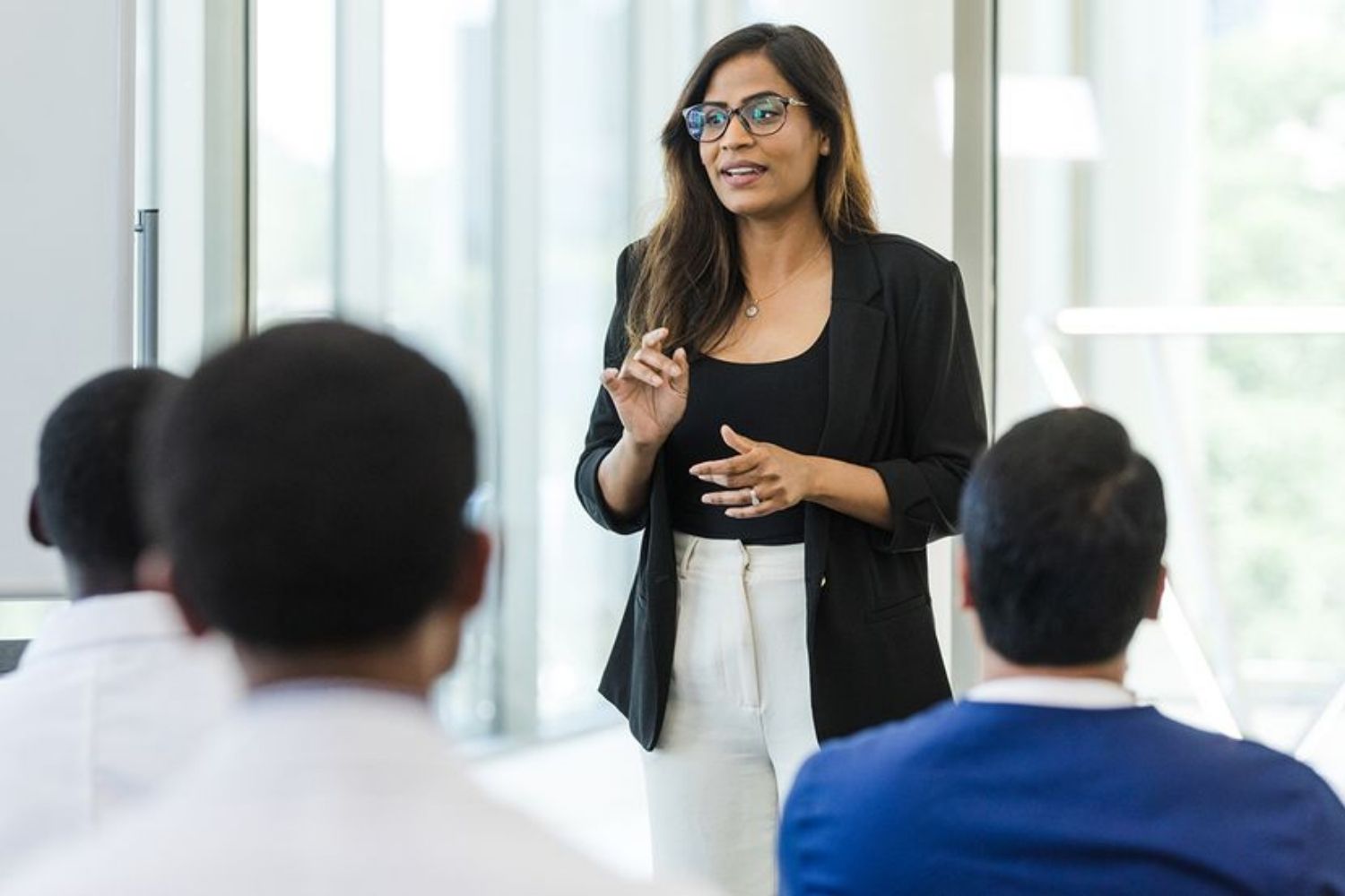 a woman giving a medical education lecture