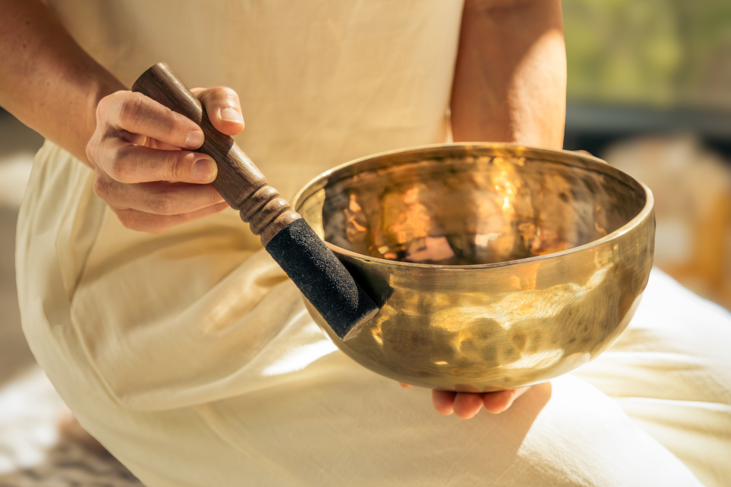A woman with a singing bowl