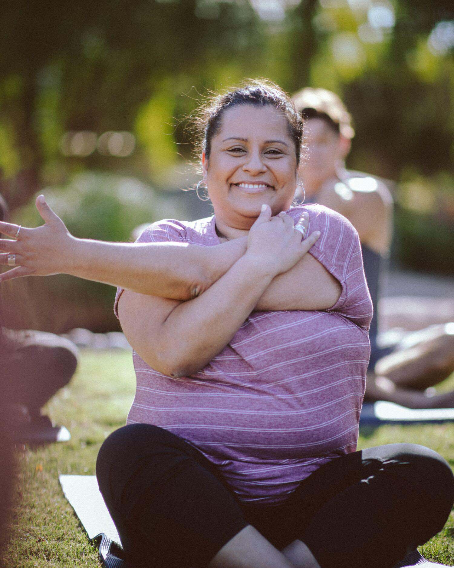 A plus sized woman doing yoga to lose weight