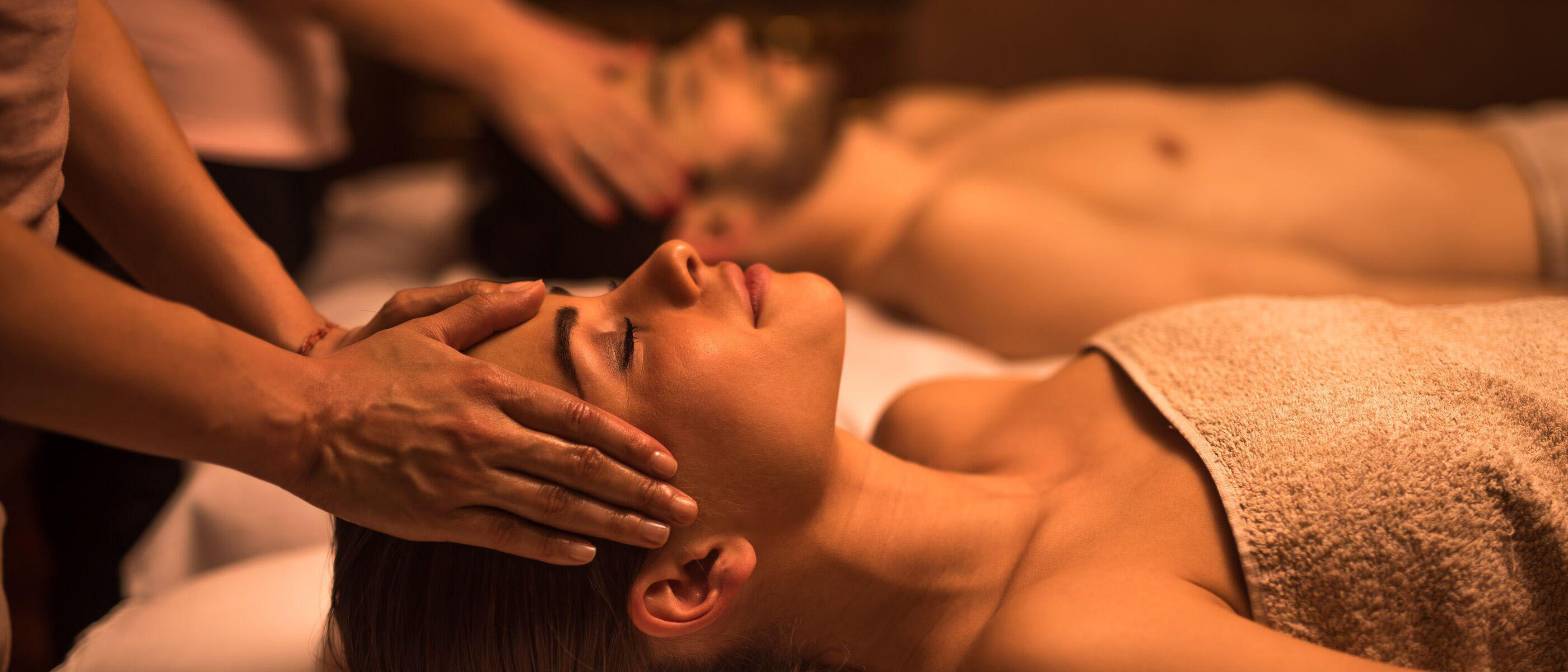 Two people getting a couples massage