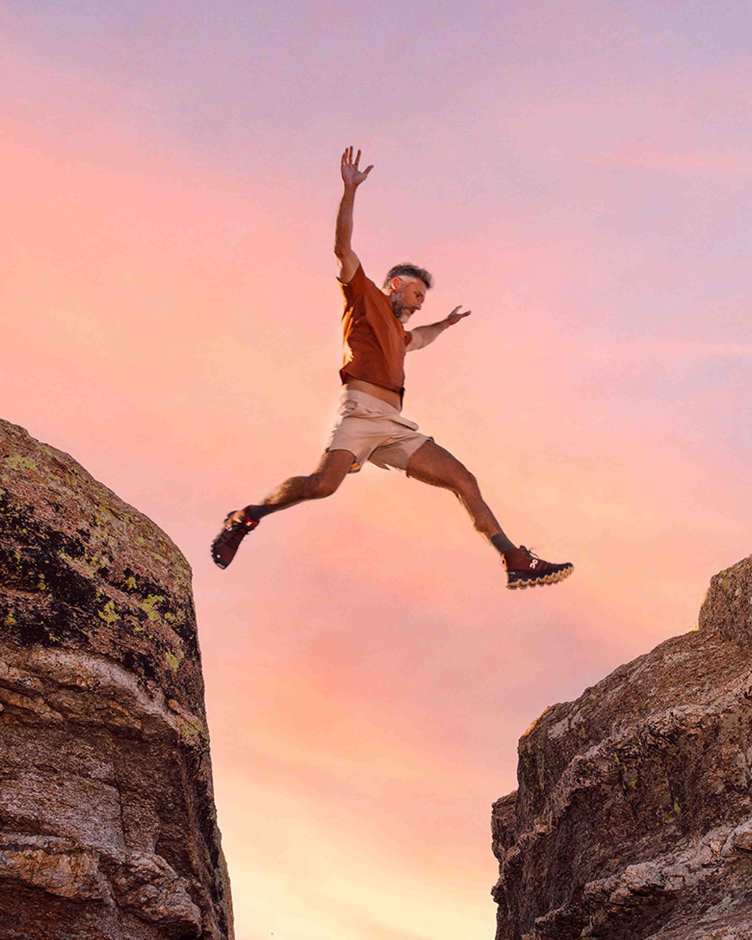 Man Jumping Over Rocks 