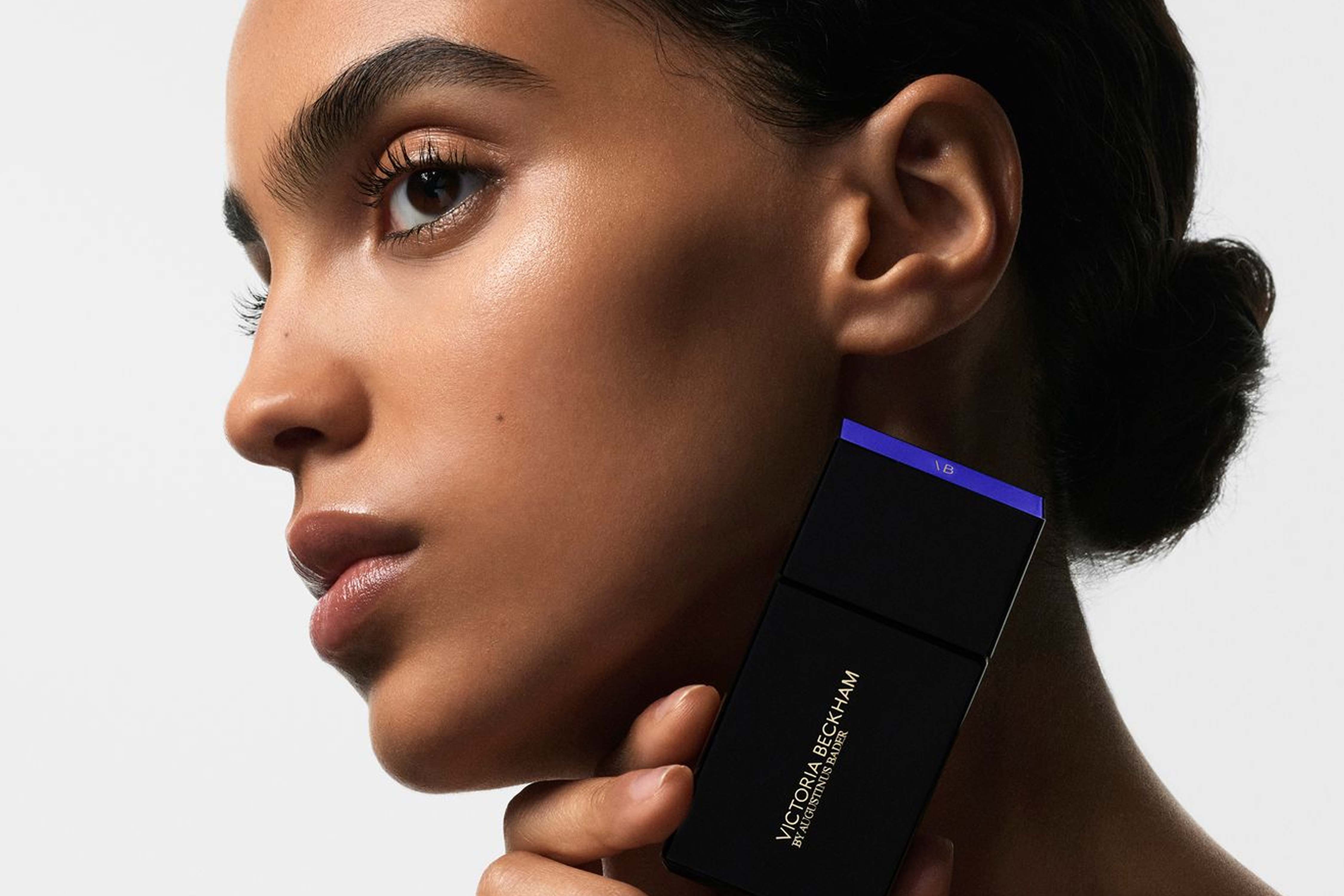 A woman holding a makeup box