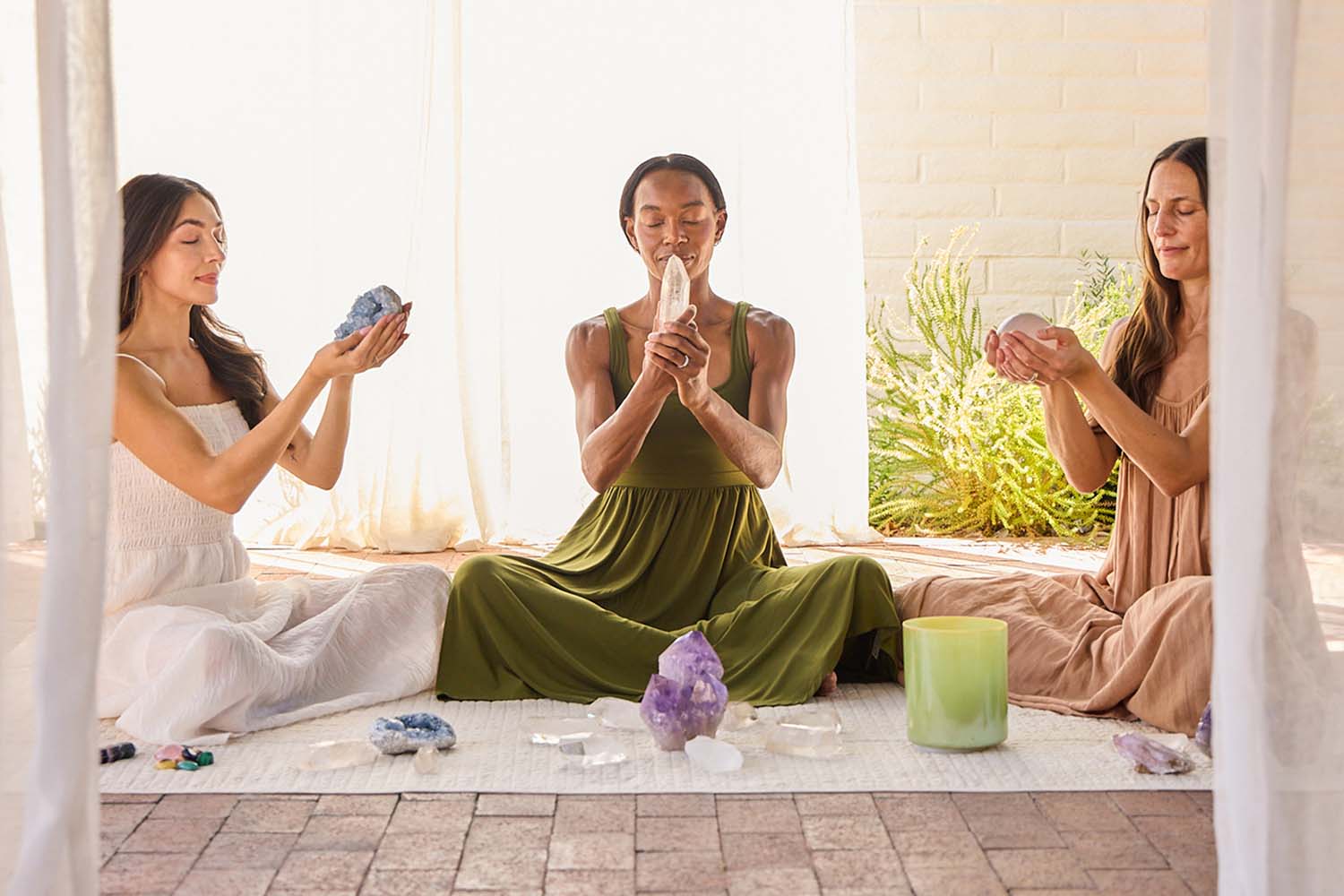 Three Women Meditating with Crystals 