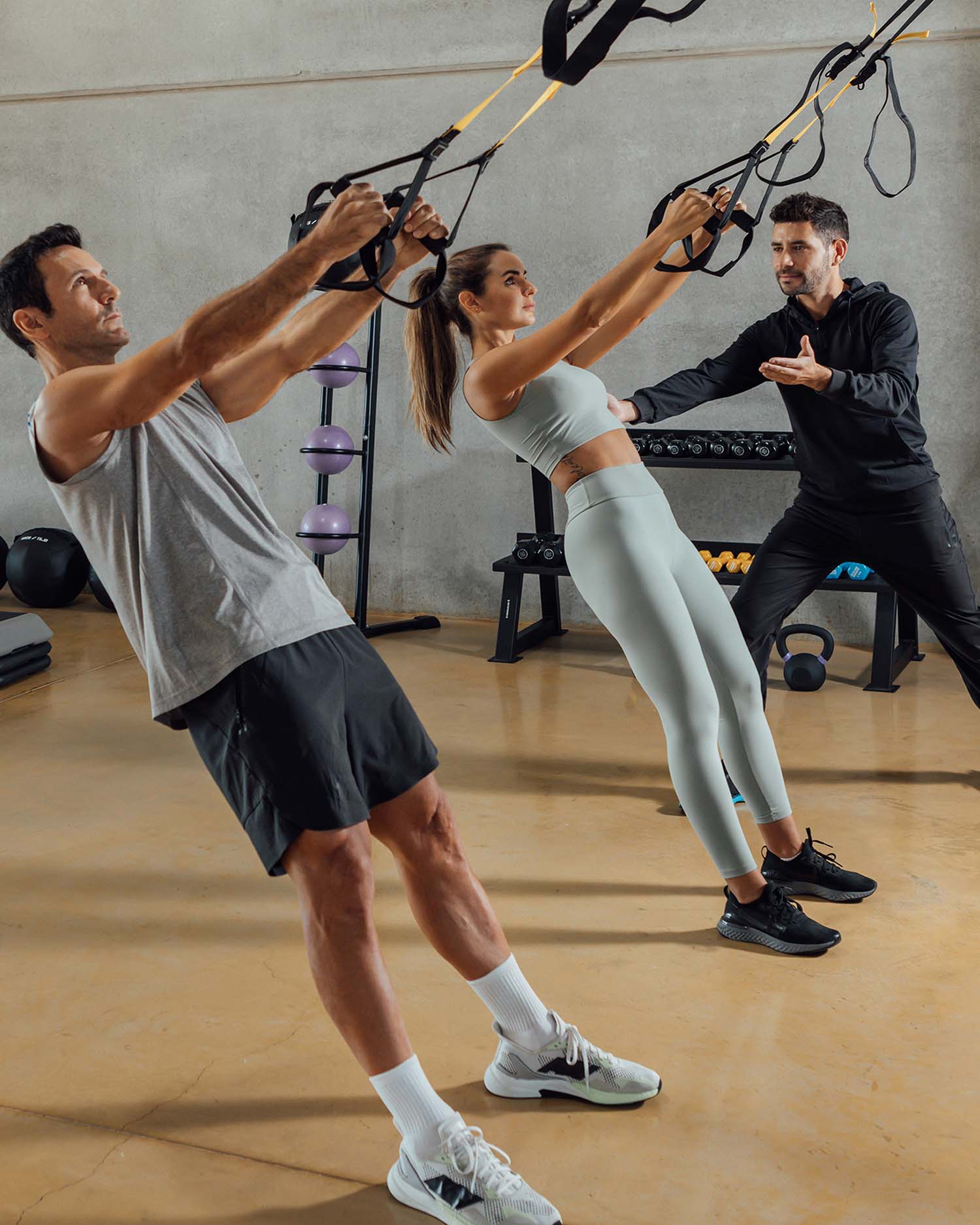 Man and Woman at a Fitness Class with Trainer