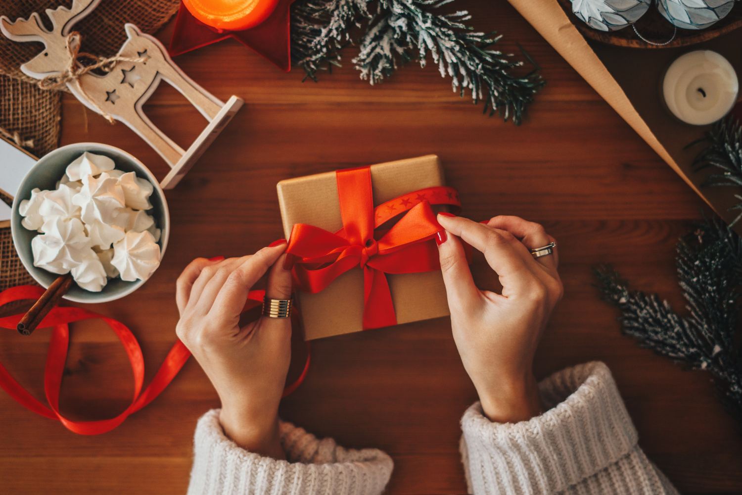 A woman wrapping a gift