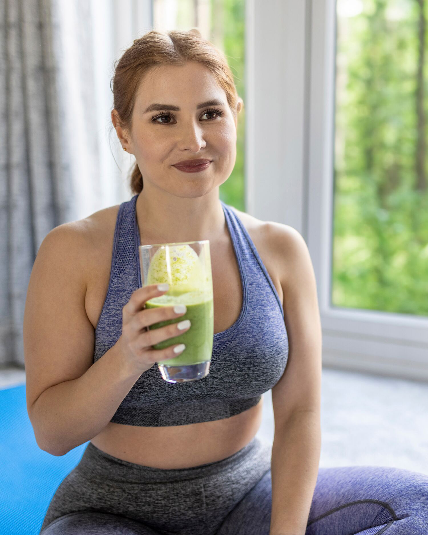 Woman Drinking a Green Smoothie