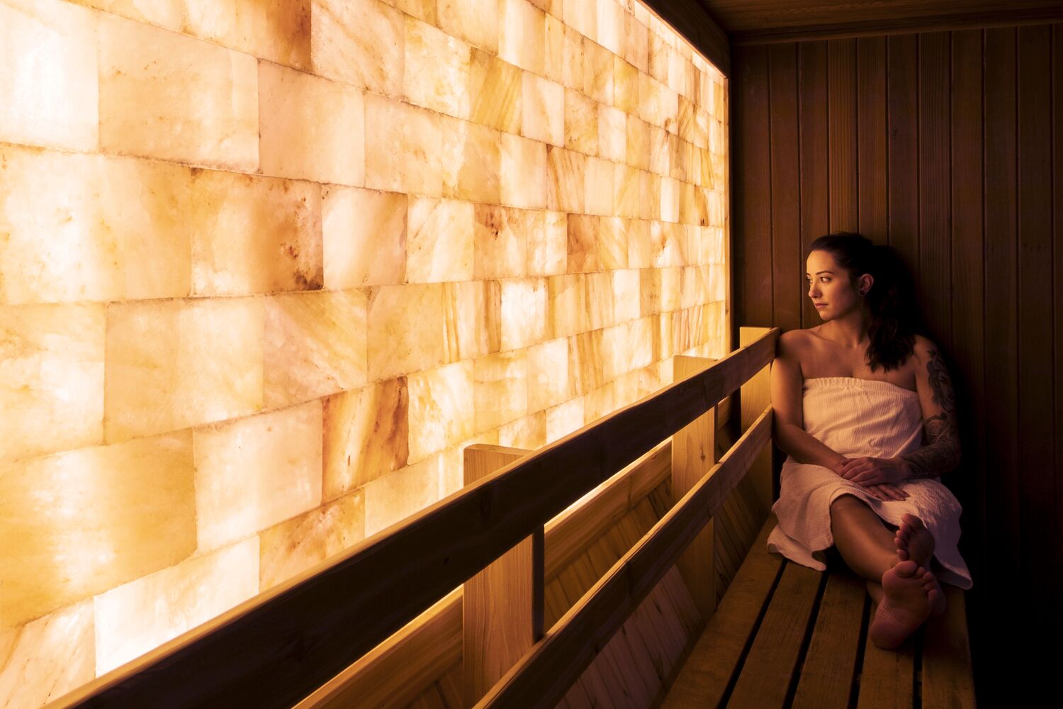 Woman Sitting in the Salt Wall Sauna at Canyon Ranch Tucson Spa