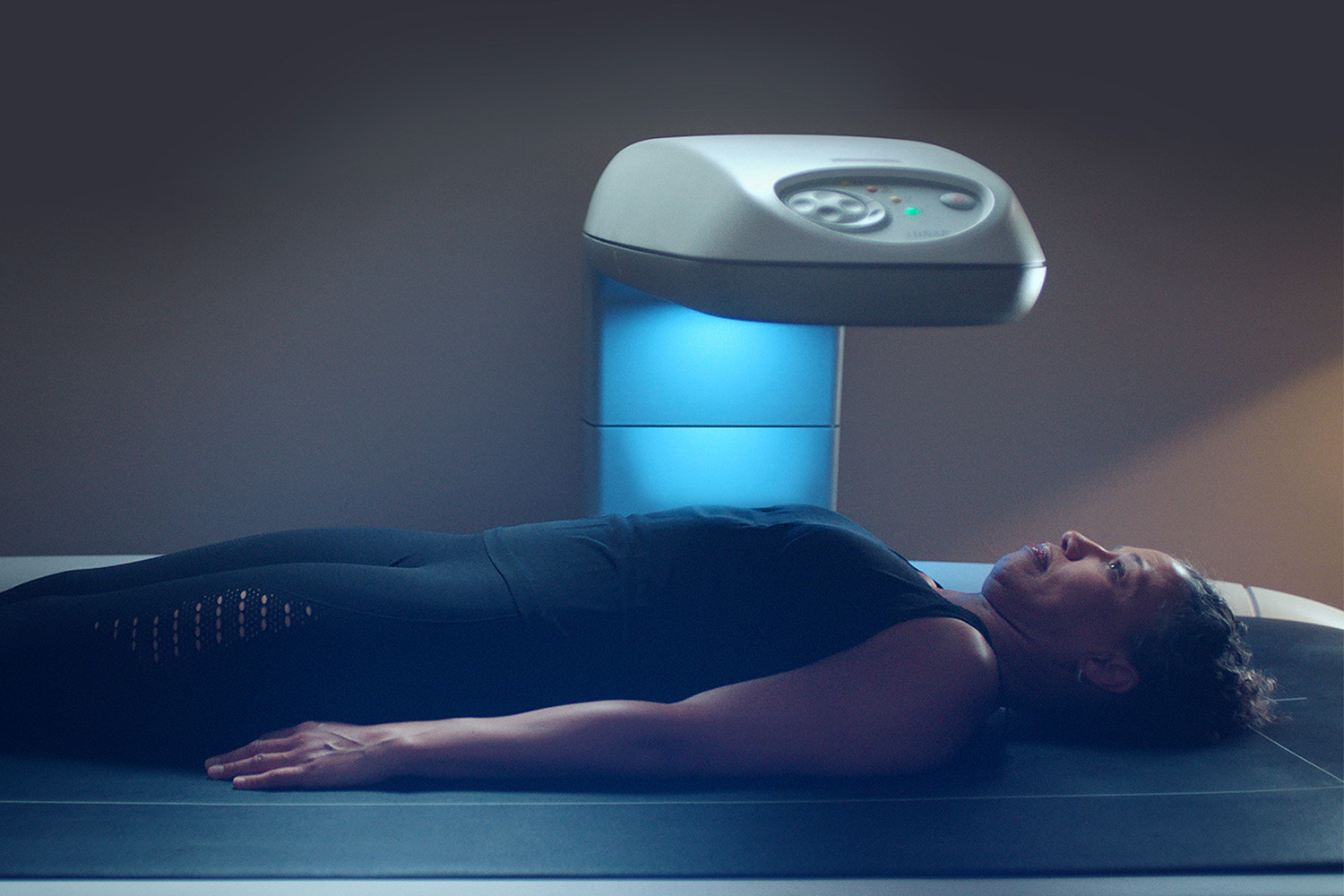 a woman getting a DEXA scan