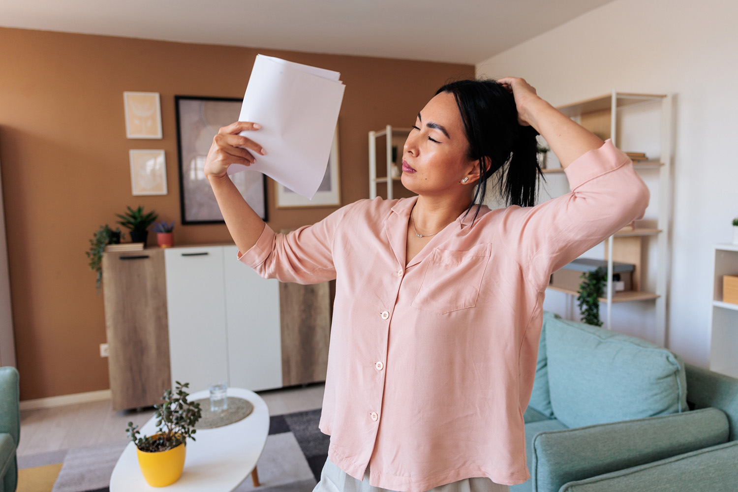 A woman fanning herself
