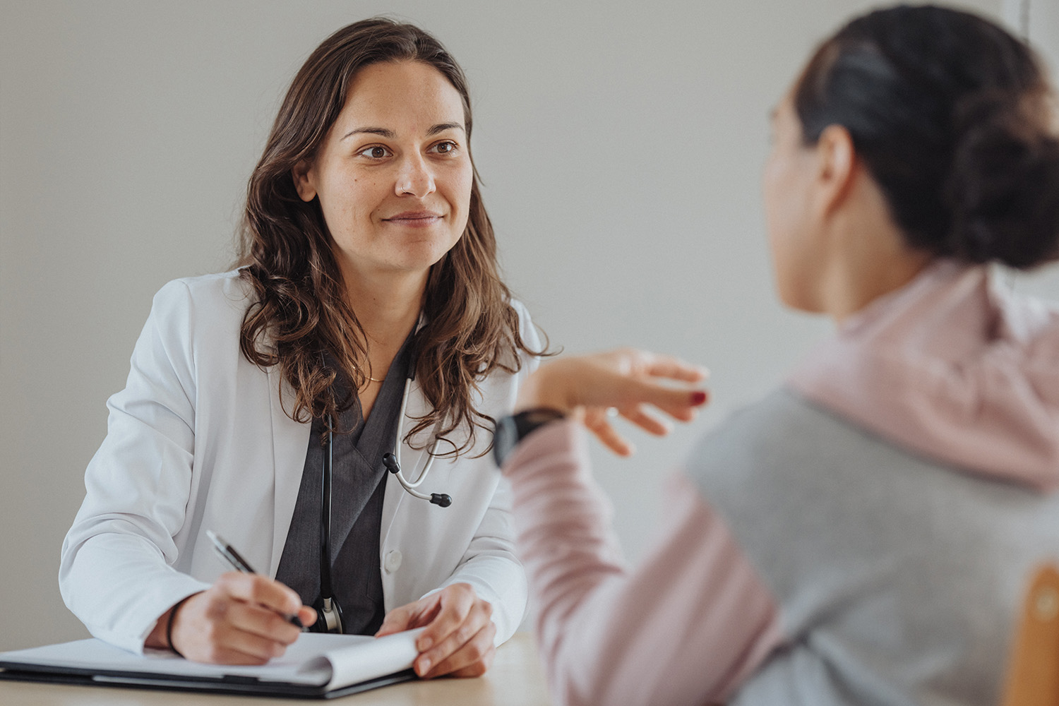 A woman getting a doctor consult