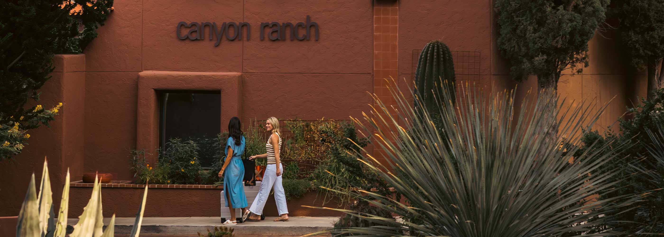 Women walking at the clubhouse at Canyon Ranch