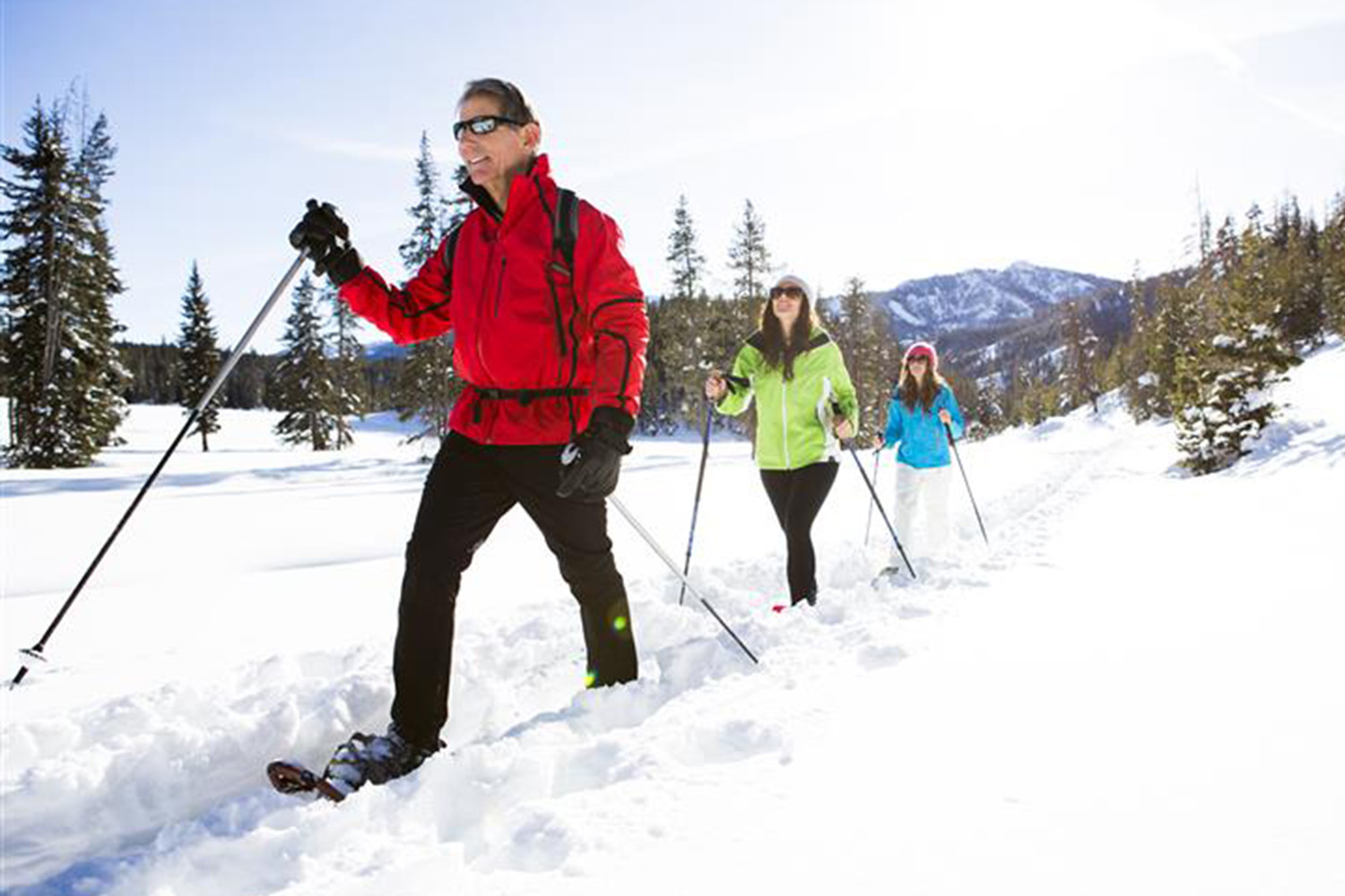 a couple hiking through the snow