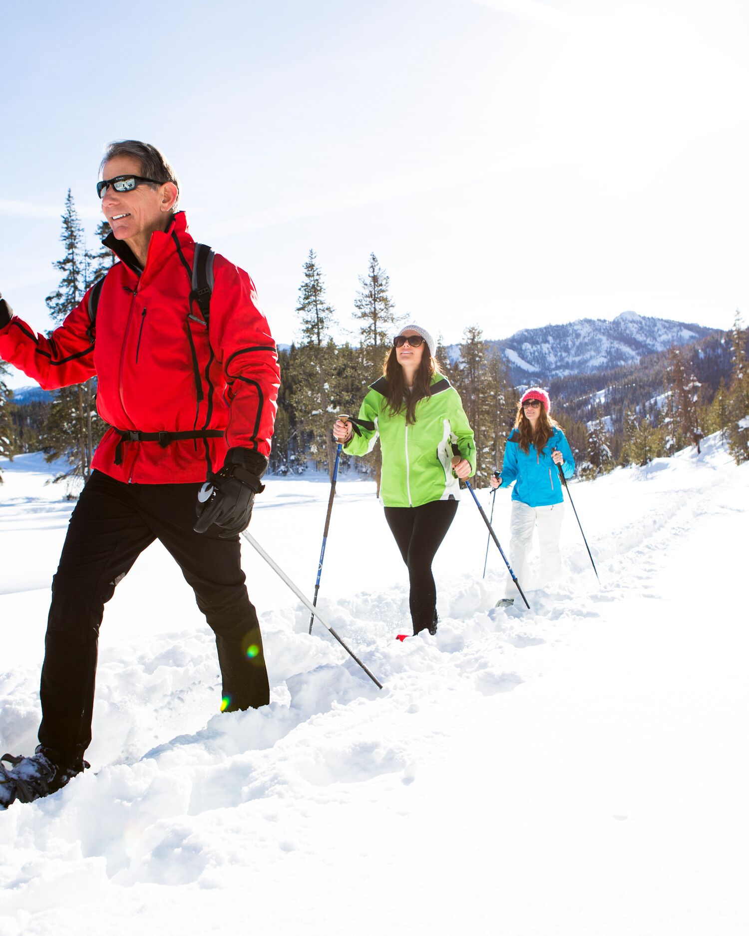 a couple hiking through the snow