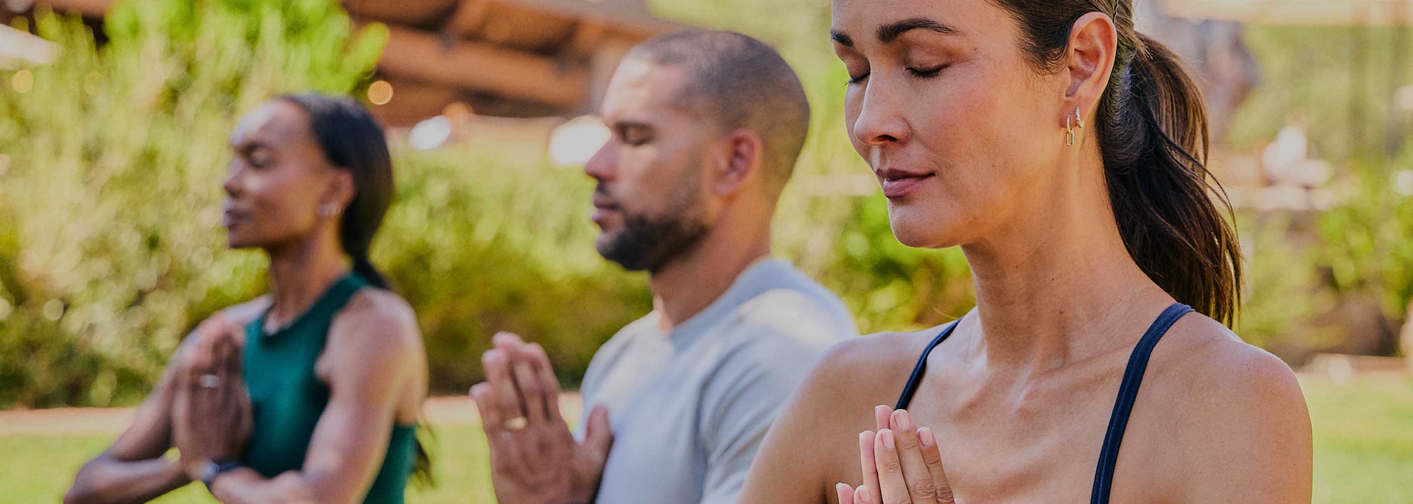 People meditating outdoors