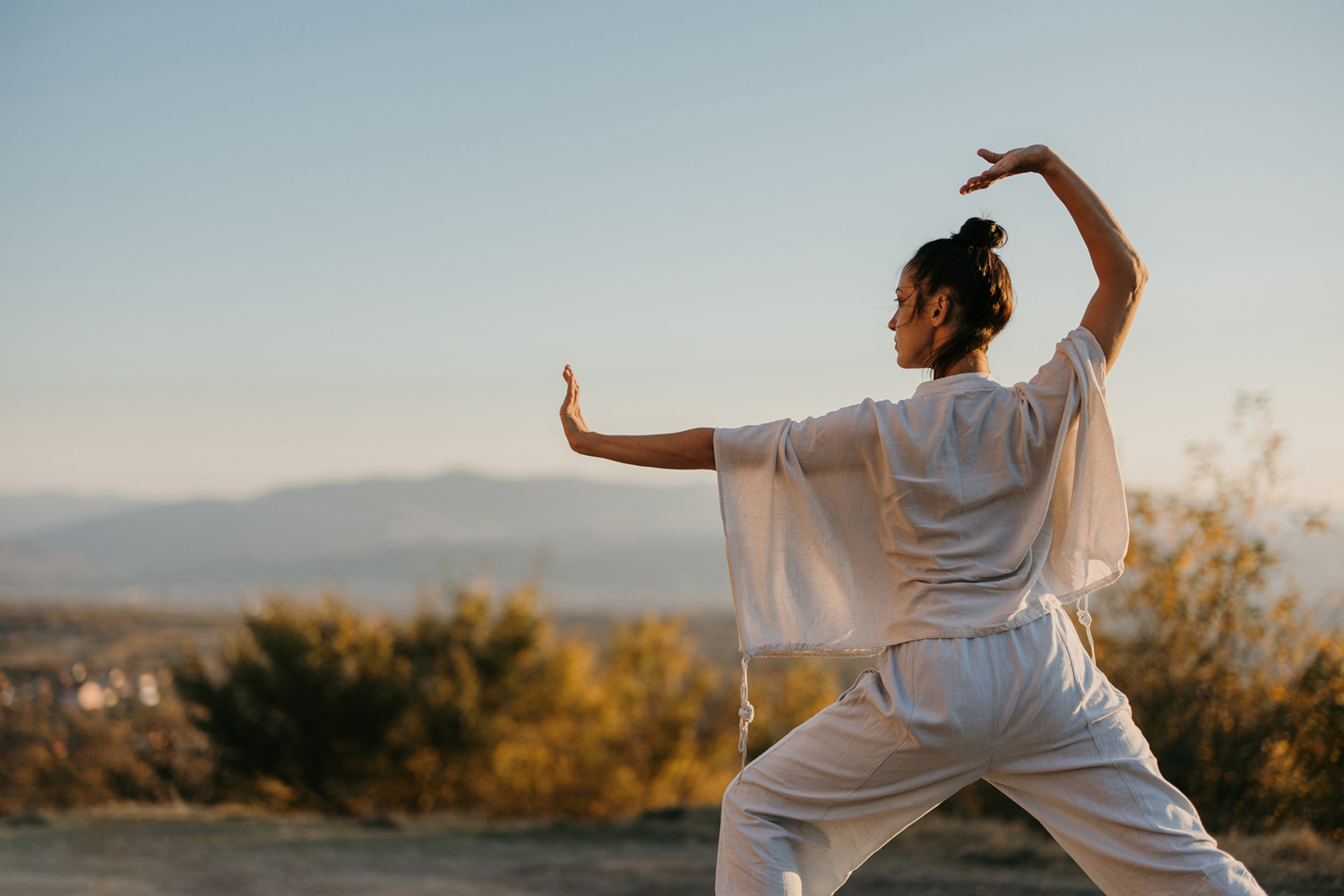 a woman doing tai chi