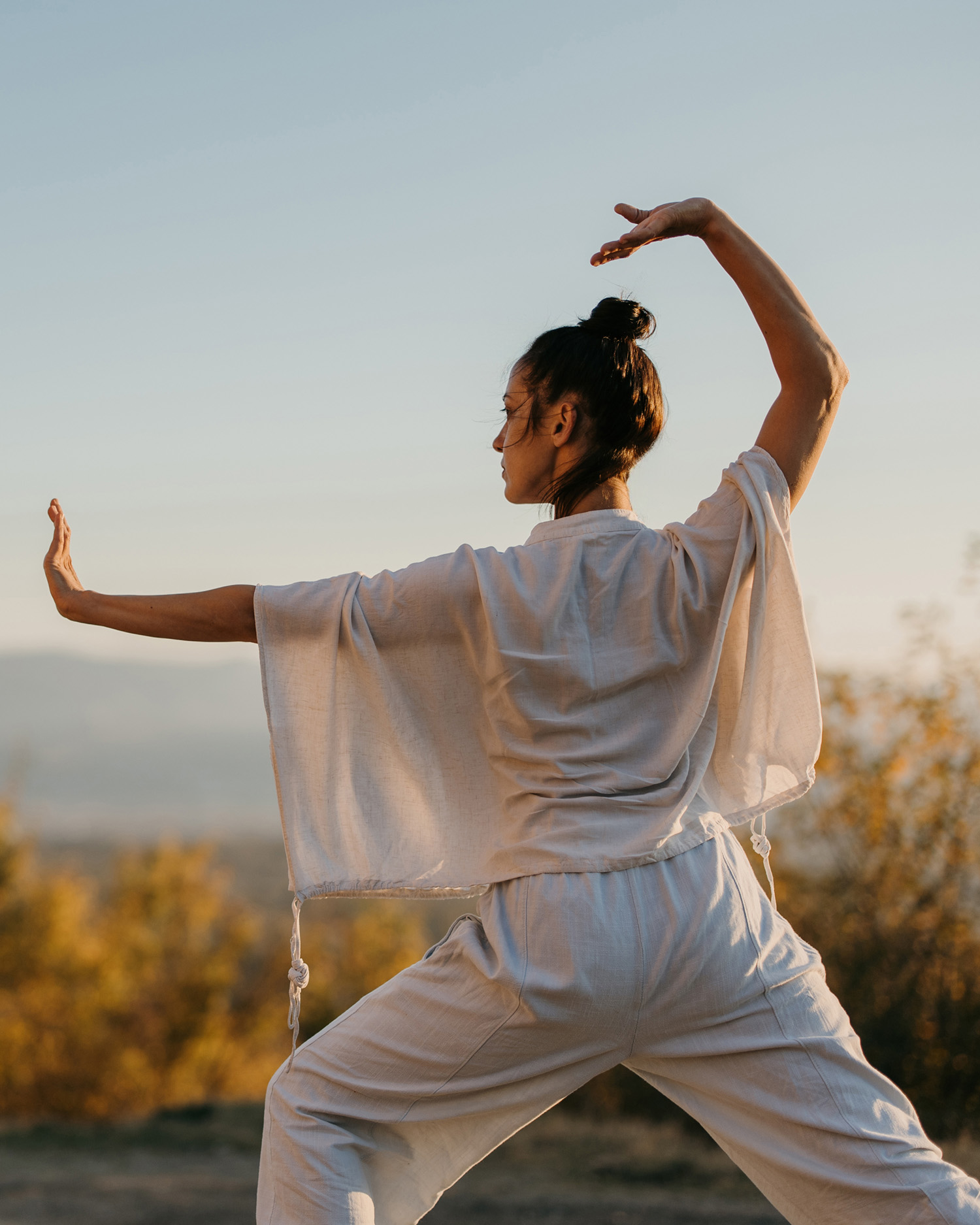 a woman doing tai chi