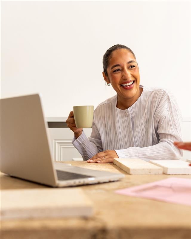 A woman holding a cup of coffee