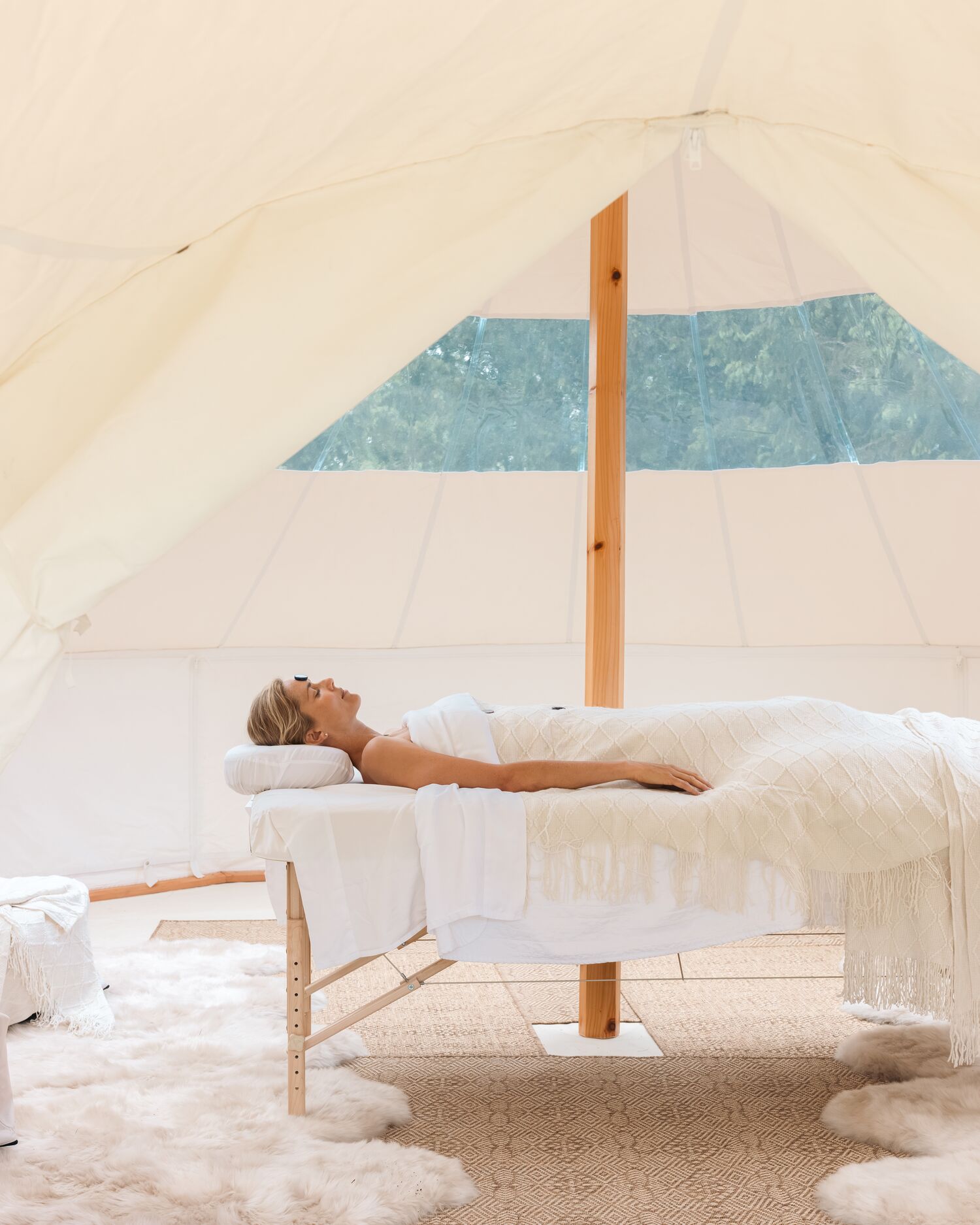 Woman Receiving a Treatment in the Tent 