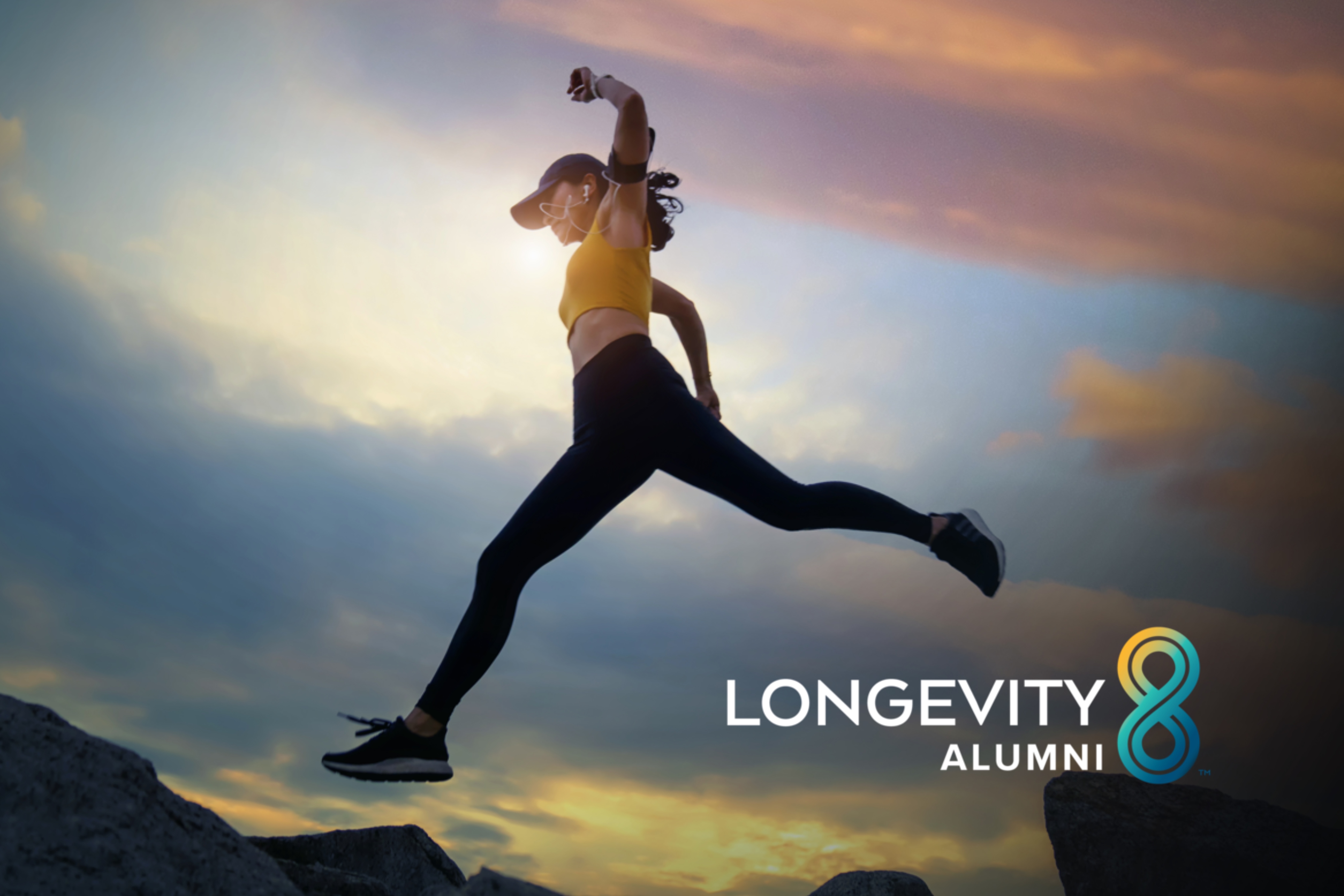 A woman leaping on boulders