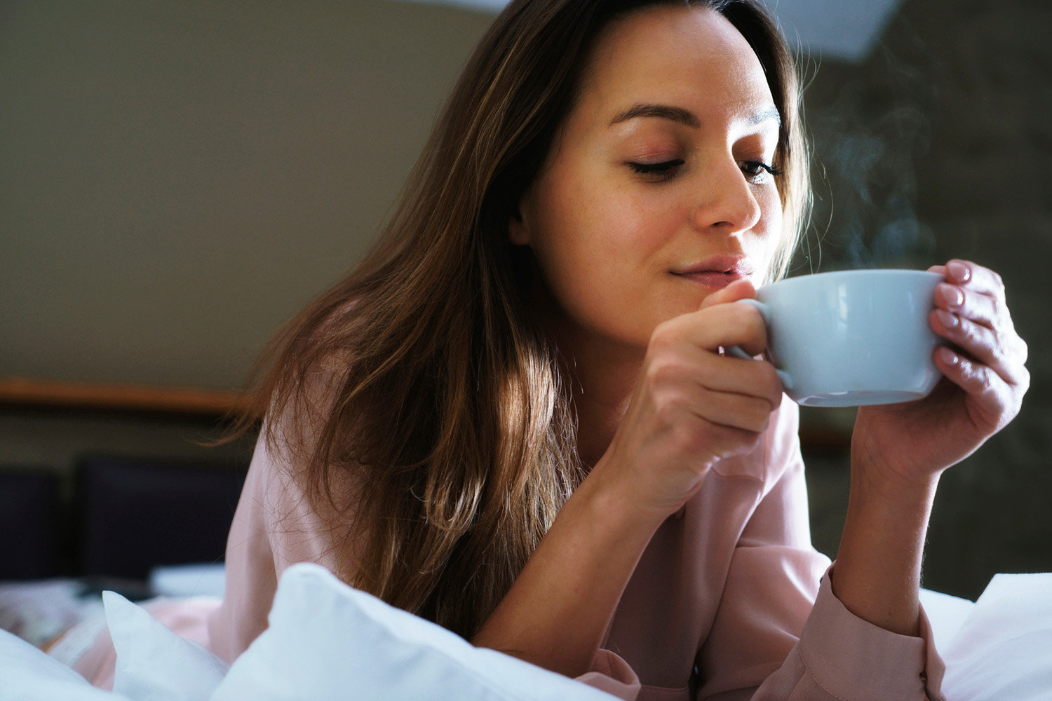 a woman drinking coffee
