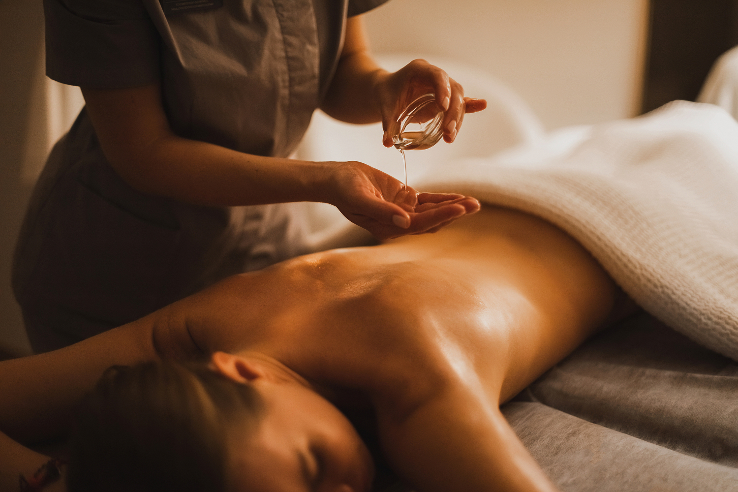 A woman getting a hot oil massage