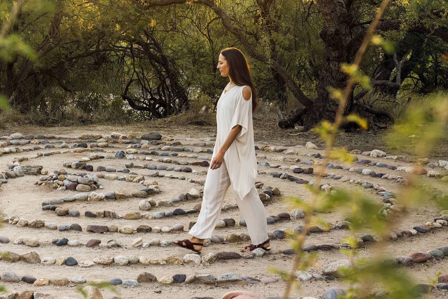 a woman walking through the labyrinth