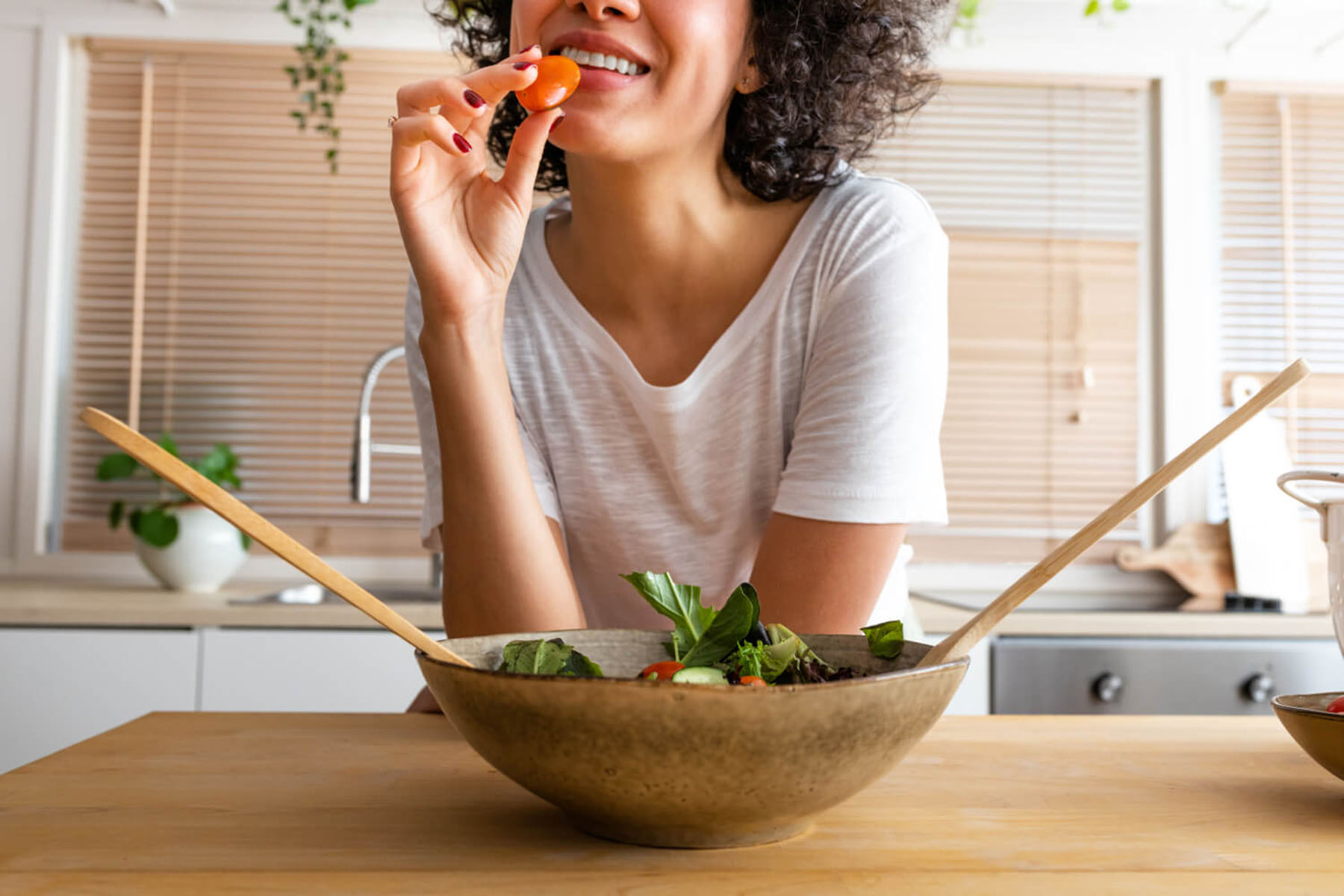 a woman eating healthy food