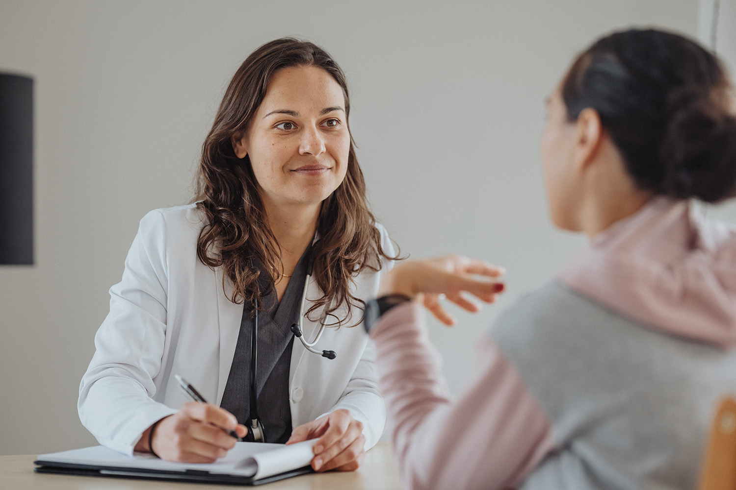 A woman talking to a doctor