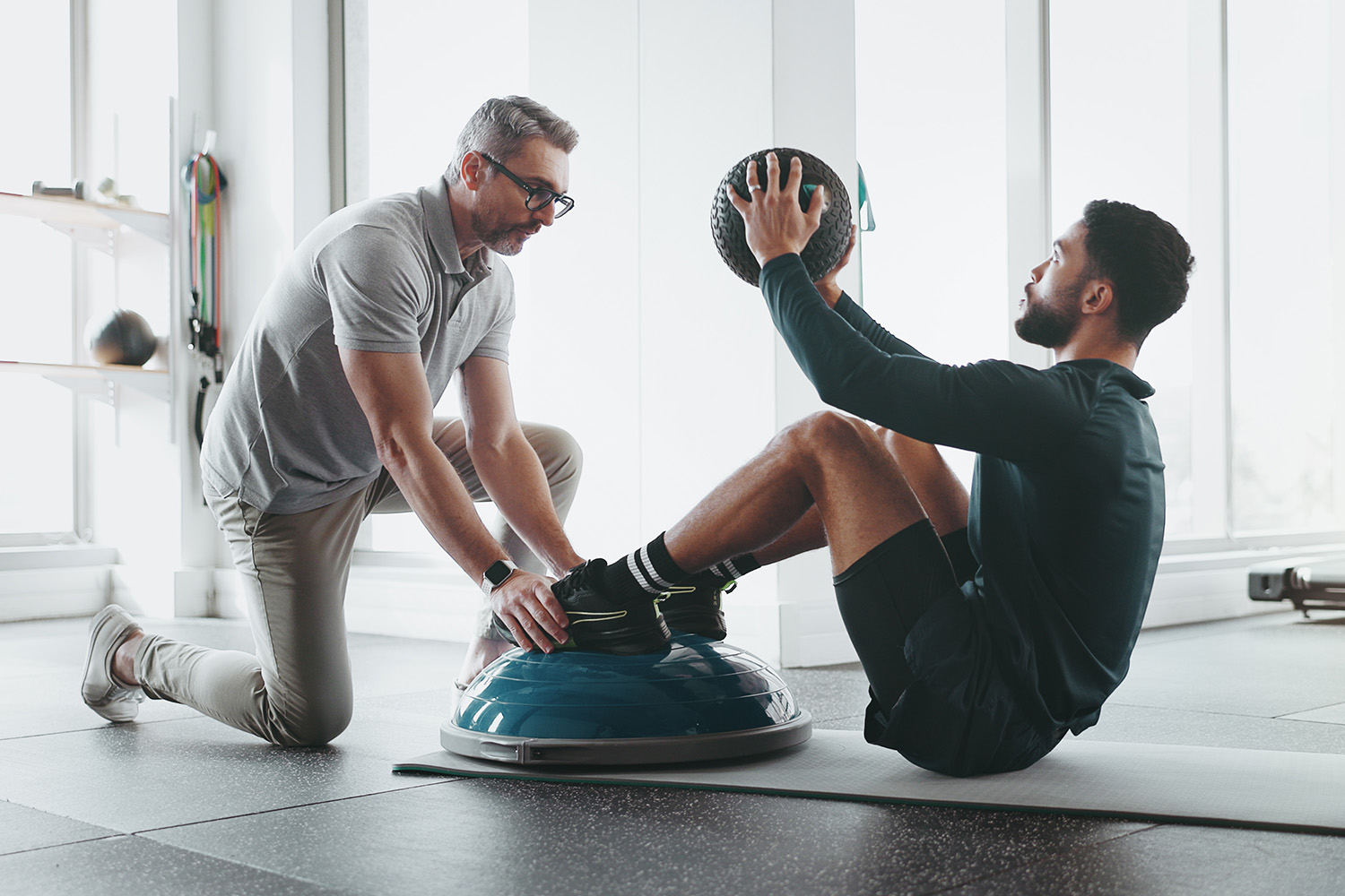 Man getting guidance during a integrated movement support training session