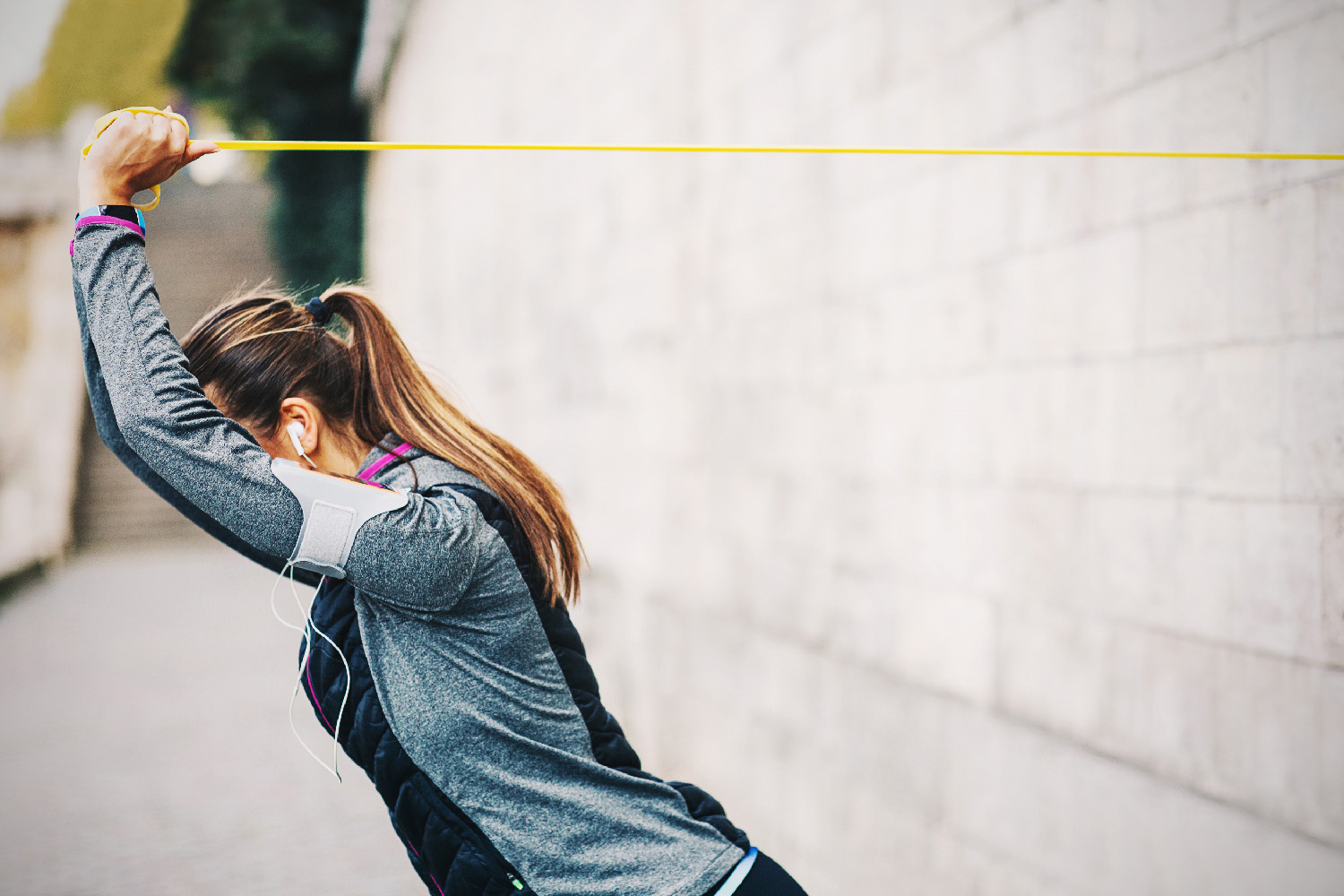 a woman stretching with resistance bands