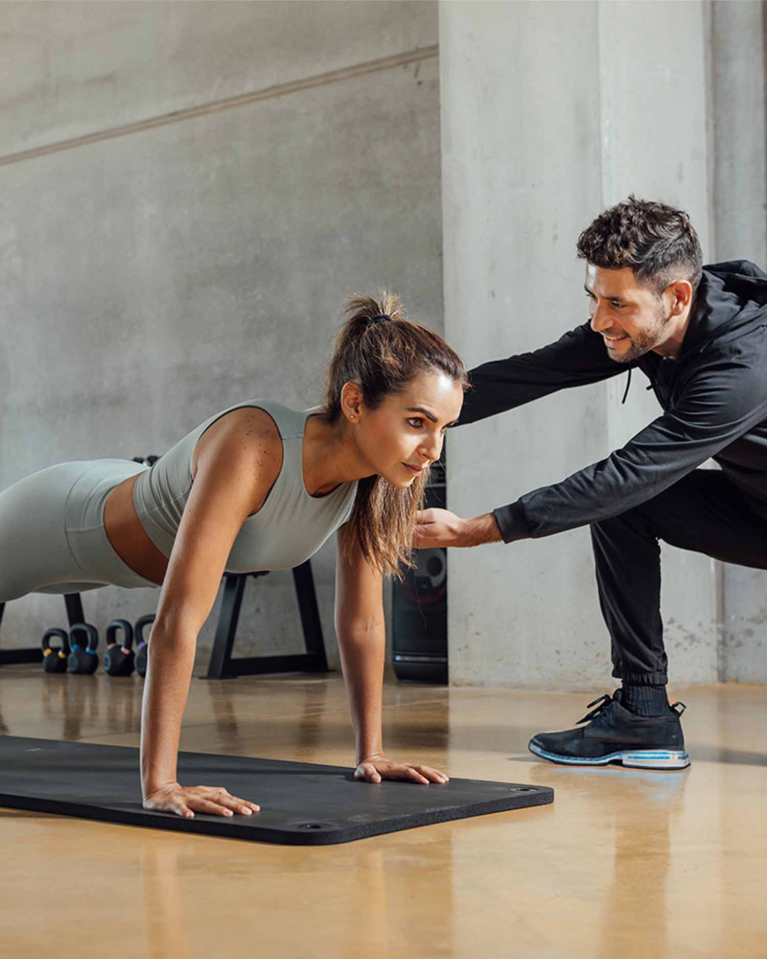 Woman Training with a Trainer During a Personal Training Session 