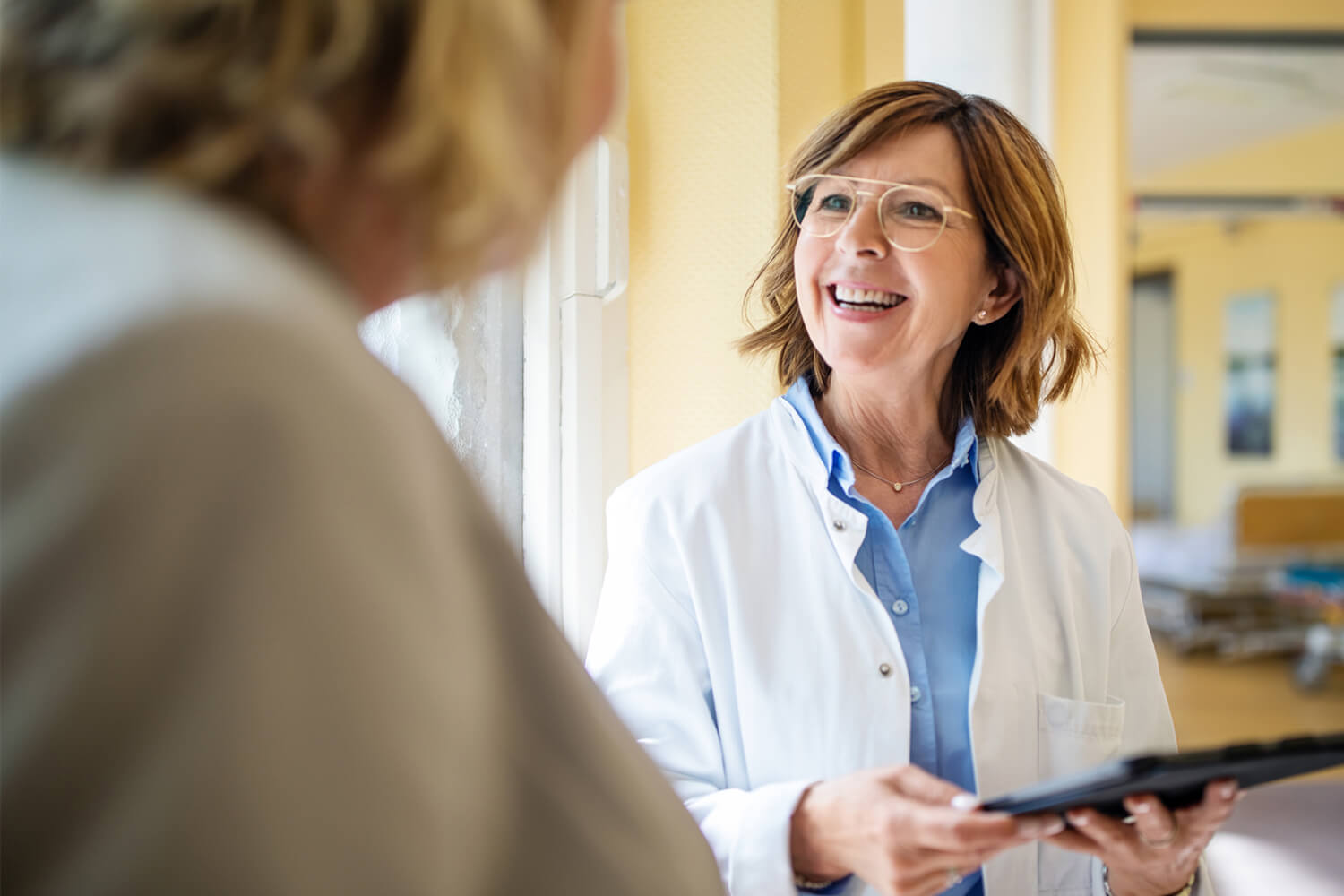 A woman breathing in deeply outdoors