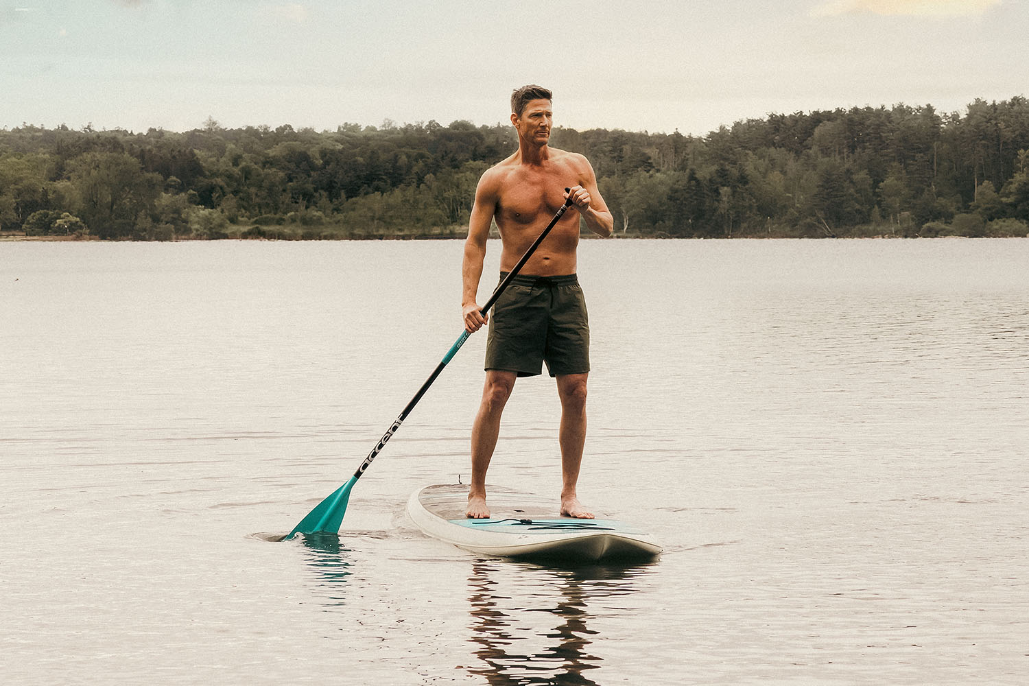 a man paddleboarding at Canyon Ranch Lenox