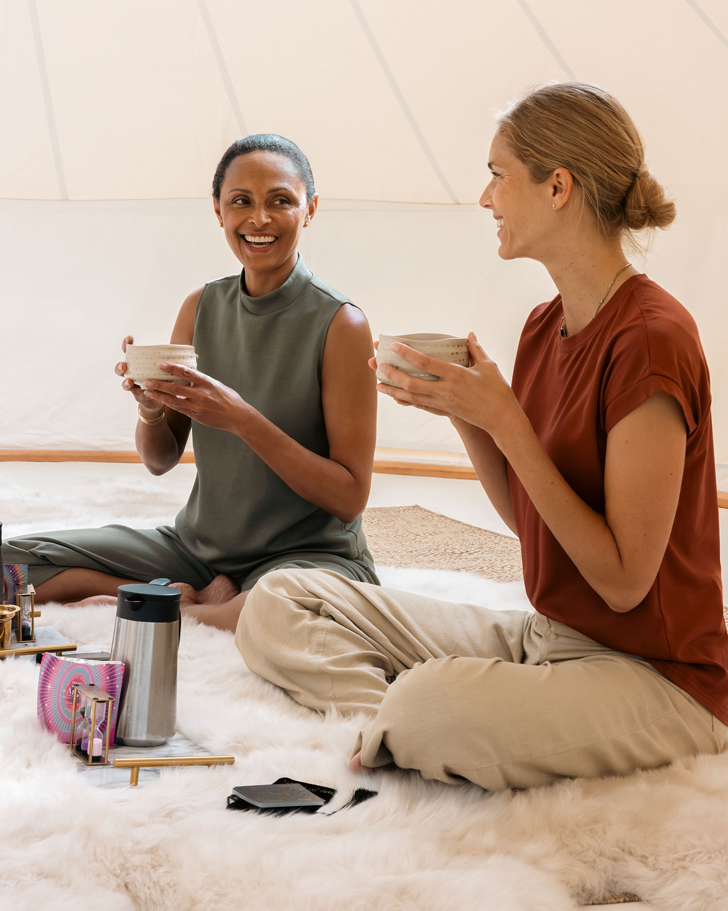 Two Women Drinking Tea During a Tarot Session