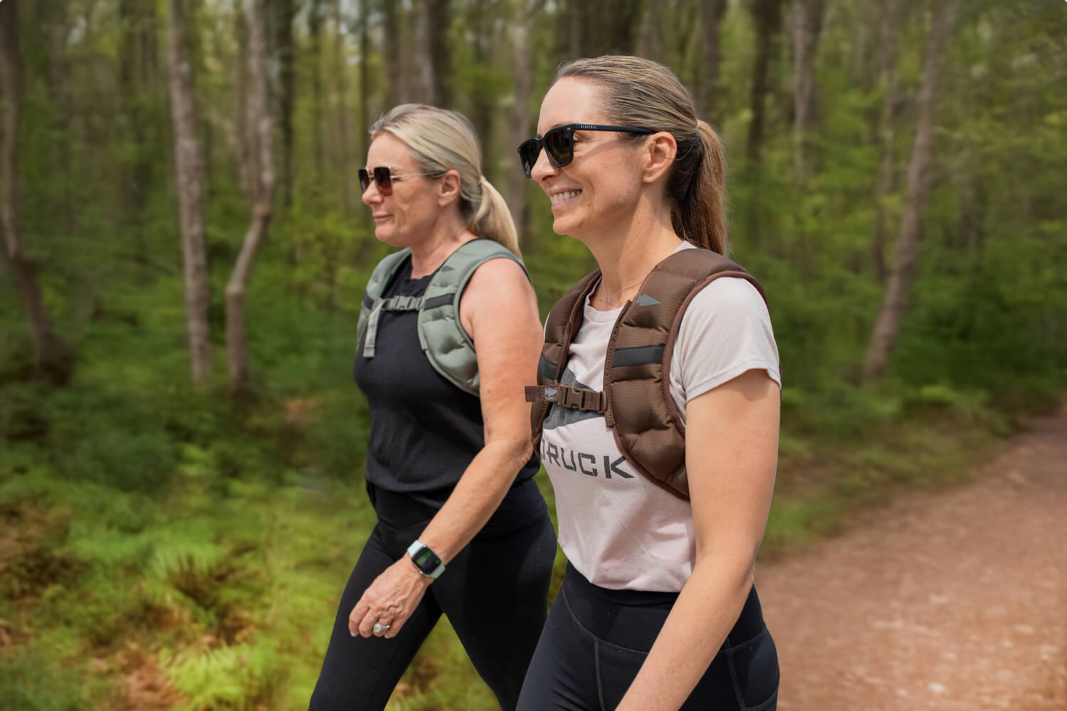 two women rucking in the woods