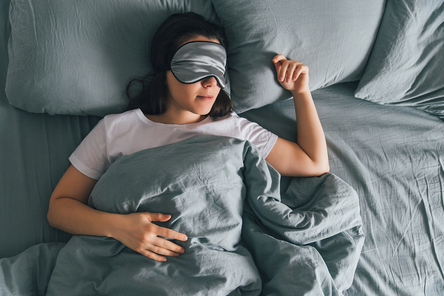 a woman sleeping in bed