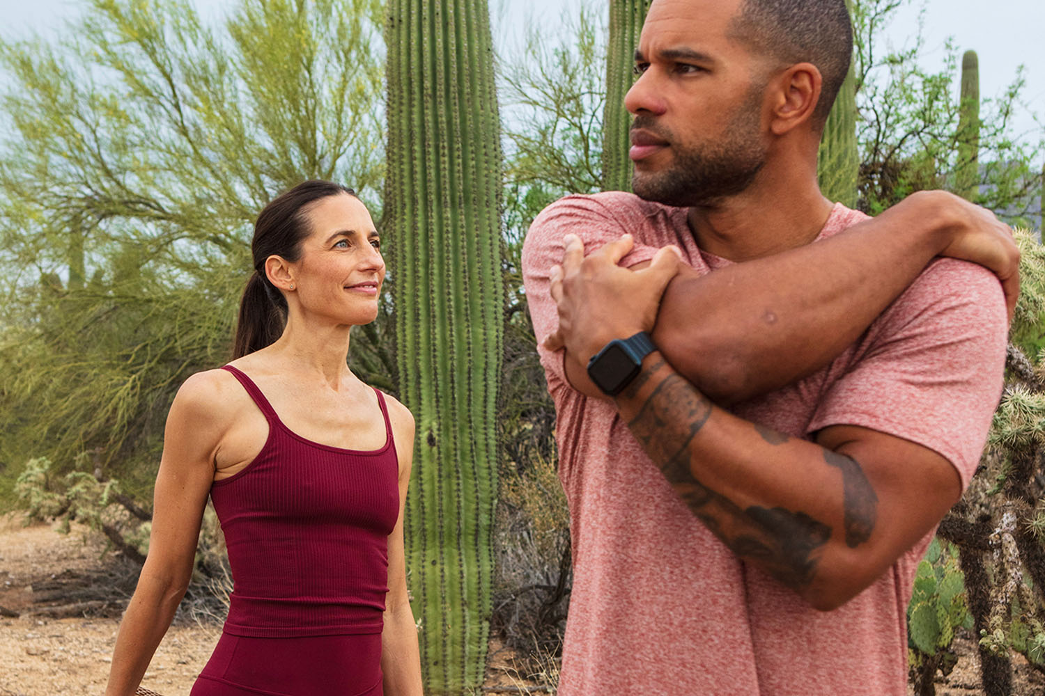 two people stretching in the Sonoran Desert