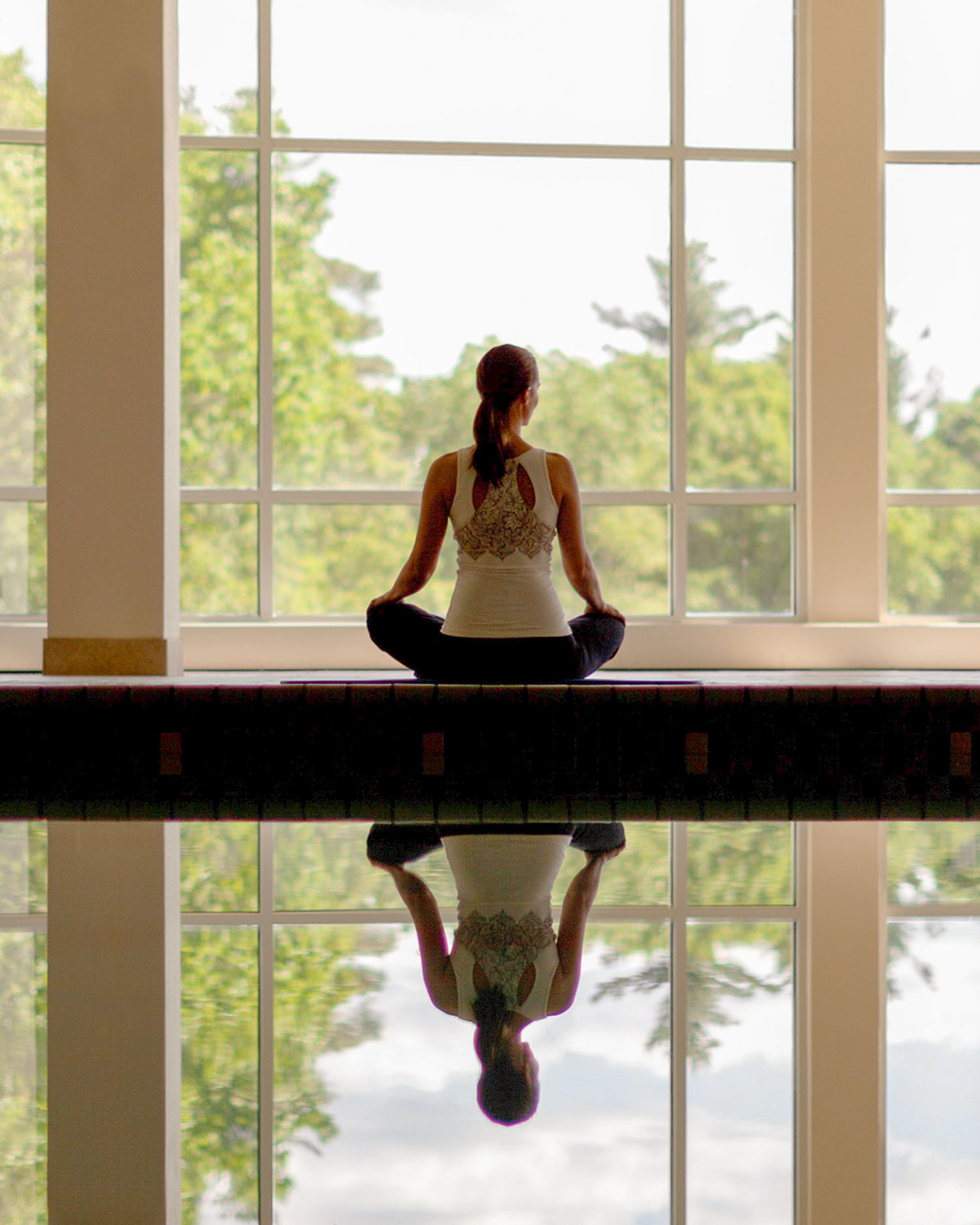 Woman Meditating at the Indoor Pool at Canyon Ranch Lenox