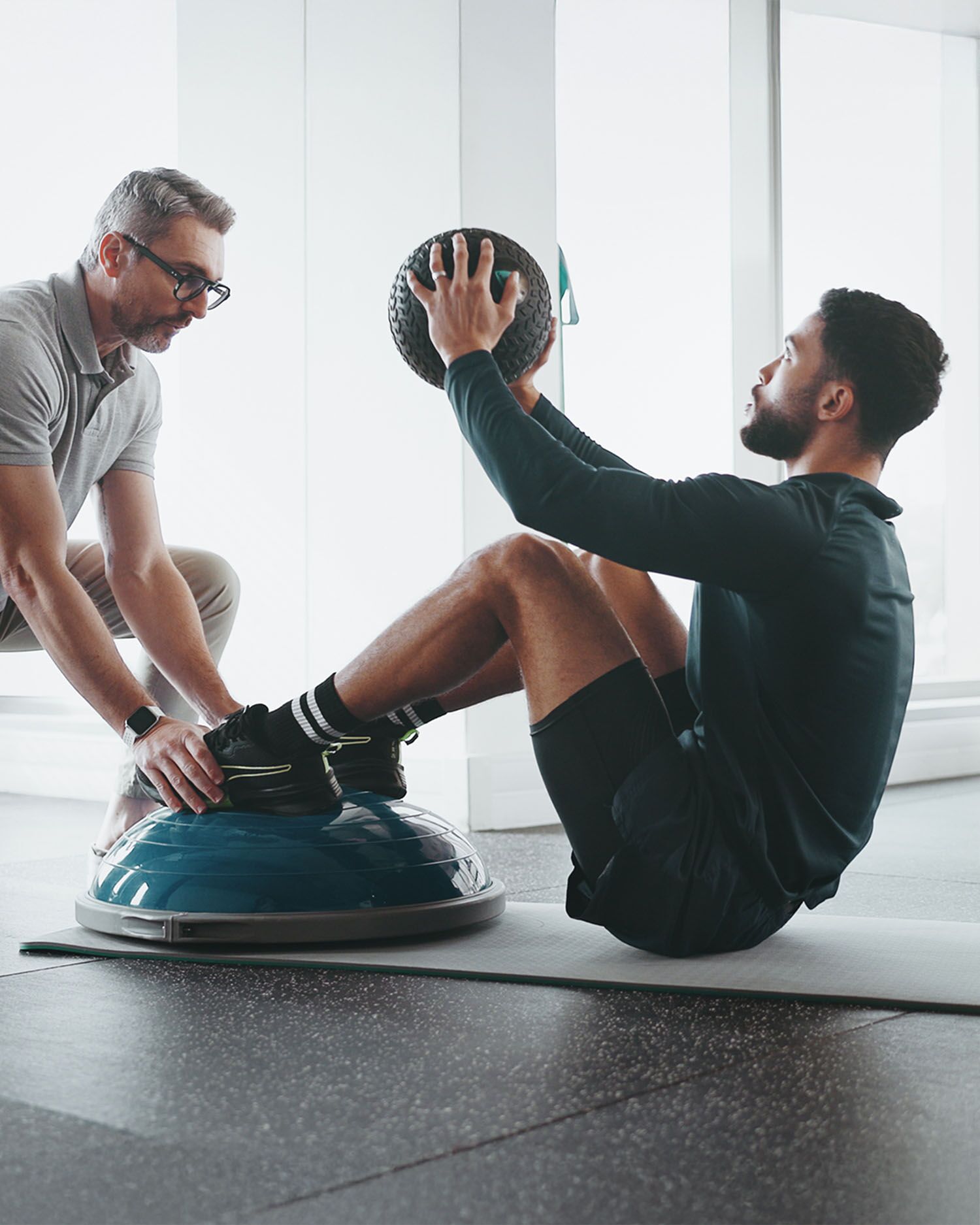 man Training with a Trainer During a Personal Training Session 