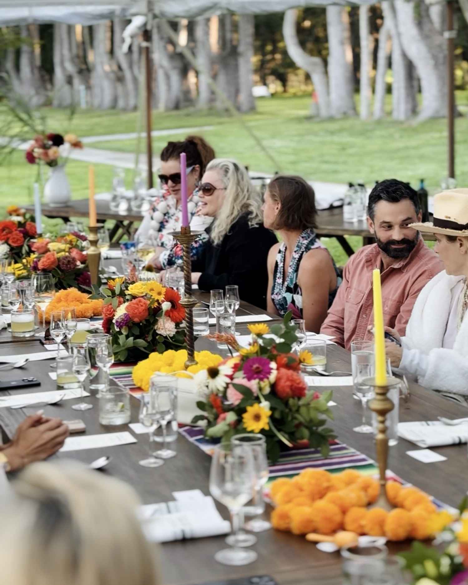 A group of people dining in a tent