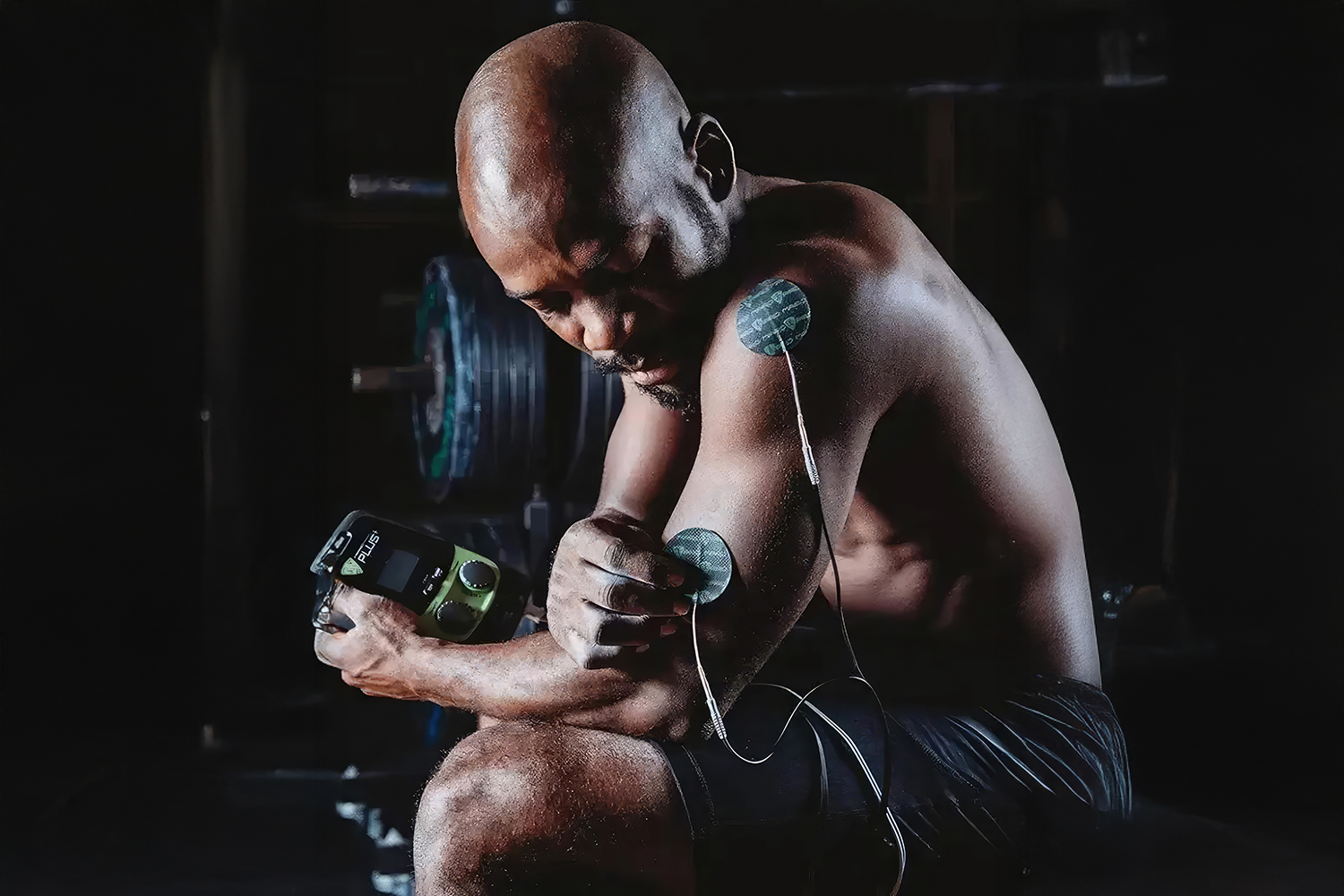 A man getting muscle stimulation therapy at Canyon Ranch Fort Worth Wellness Club